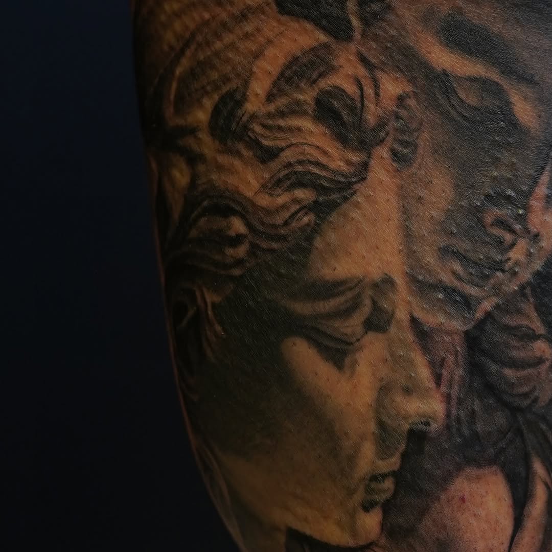 Classical sculpture portrait realism tattoo on the forearm by Eric RudeInk