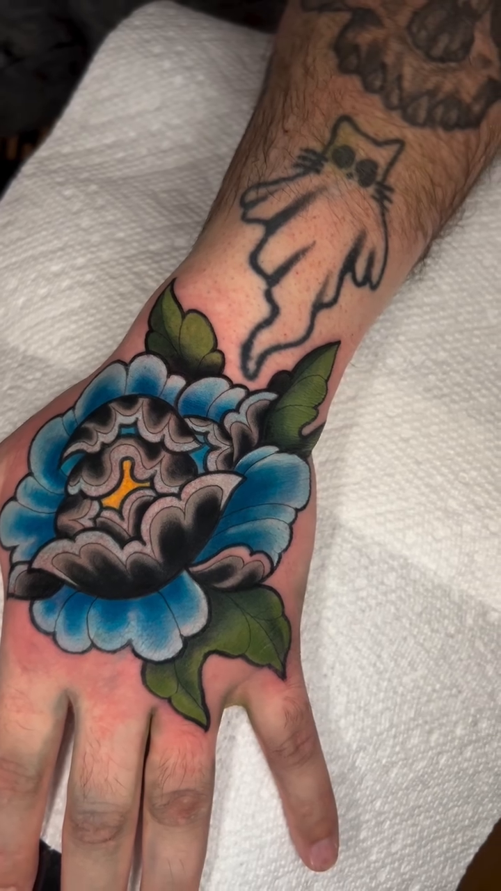 Peony tattoo on hand neo-traditional tattoo on the hand by High Vibrations