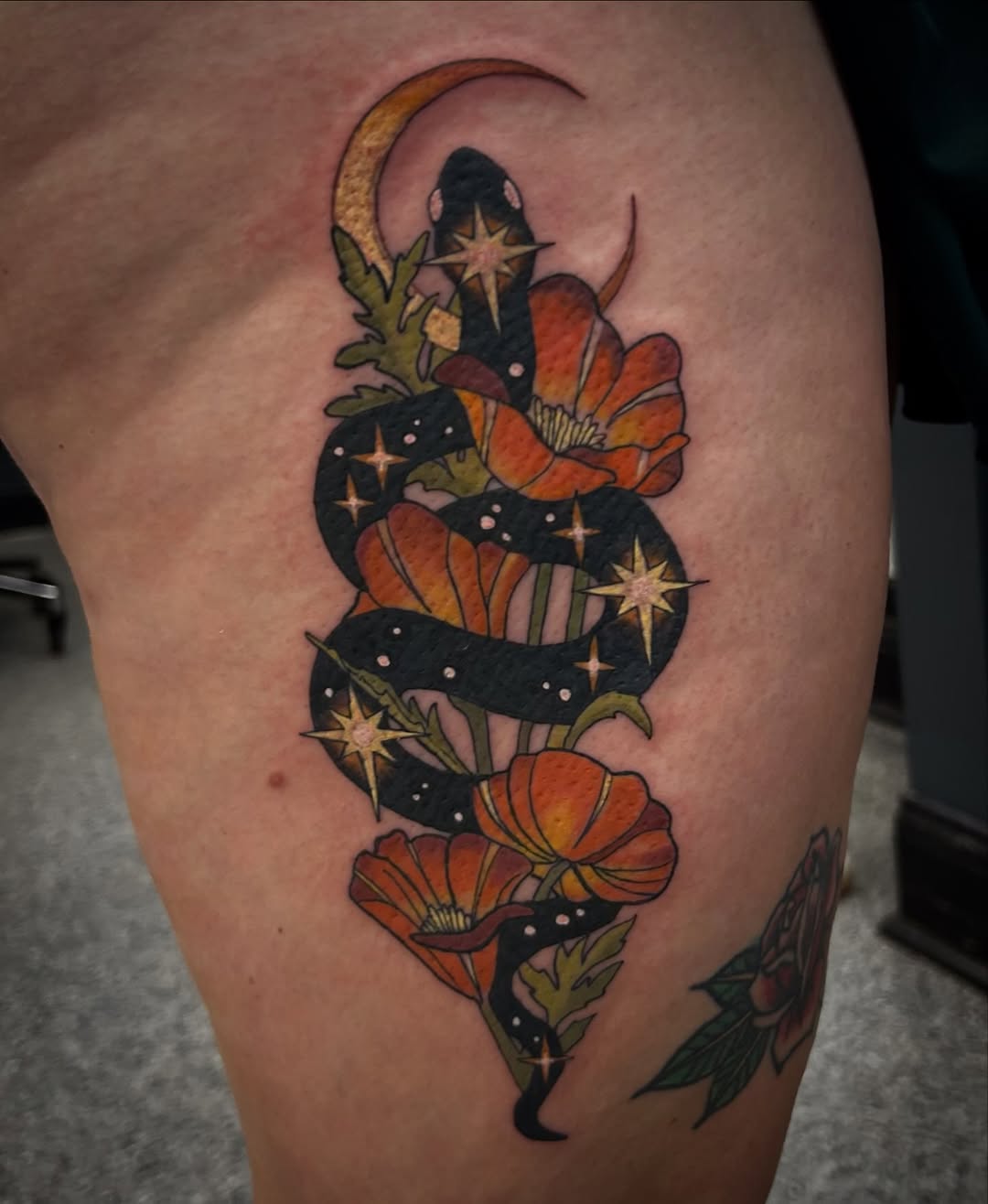 Snake with moon and poppies American traditional tattoo on the thigh by Gillian