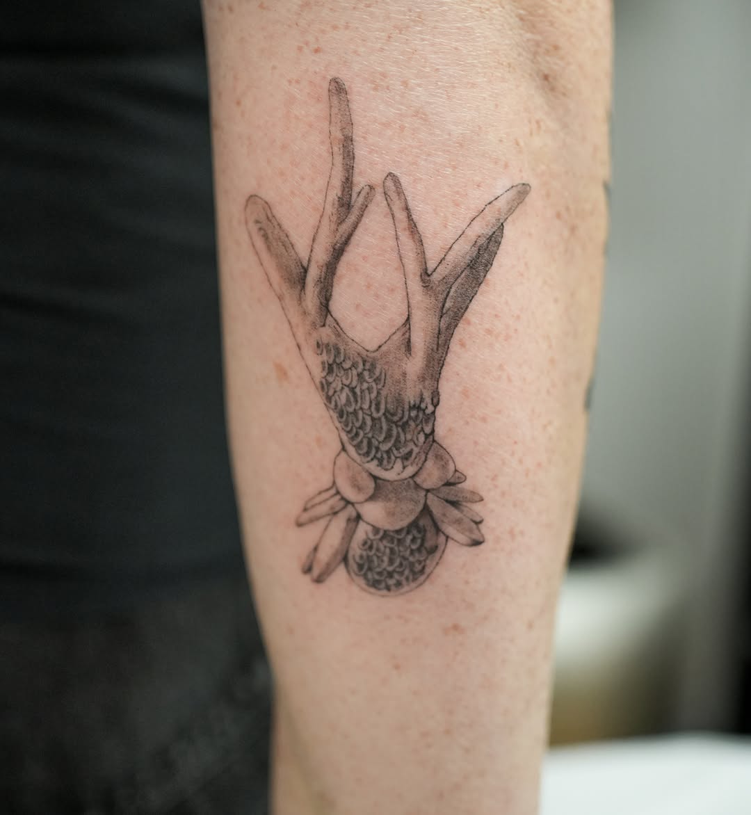 Antlers and scales fine line tattoo on the forearm by Hery Anwar