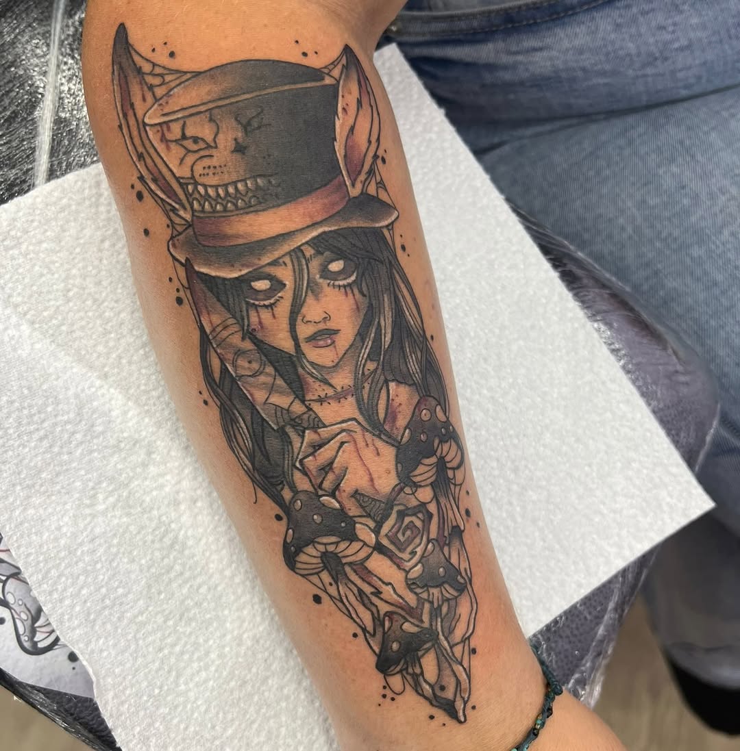Creepy alice with mushrooms realism tattoo on the forearm by elly, Oakham