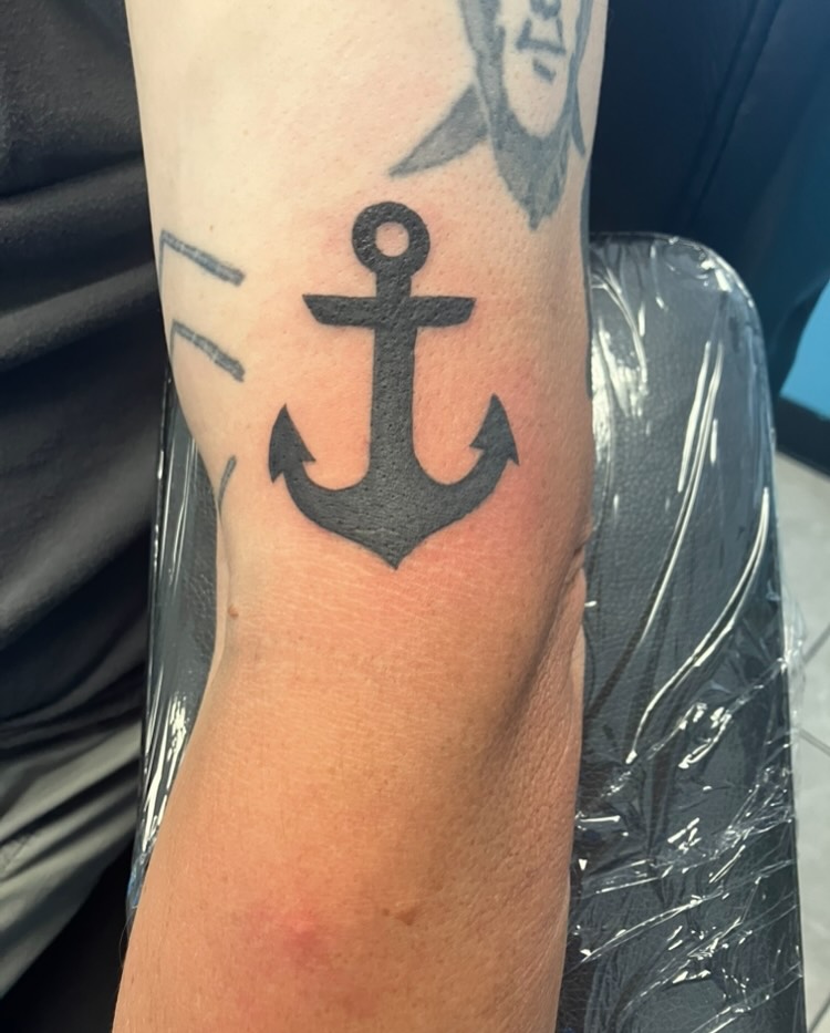 Anchor fine line tattoo on the forearm by Bryant Johnson