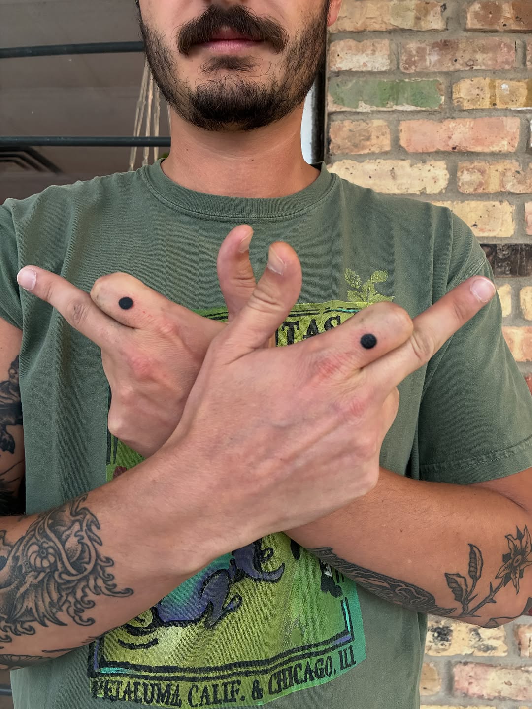Two dots ignorant tattoo on the hand by Zachary R Bobkoff