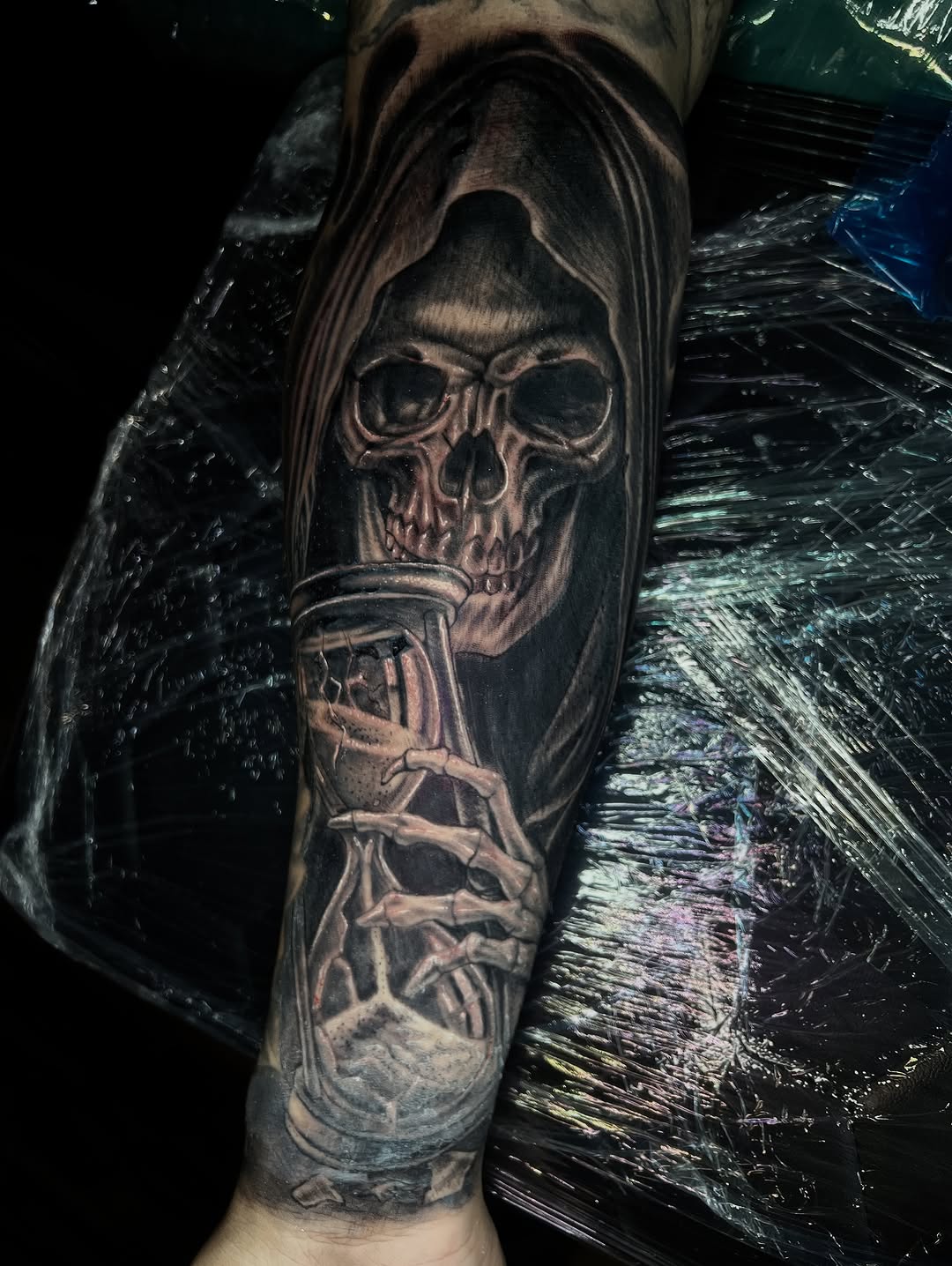 Grim reaper with hourglass realism tattoo on the forearm by Monstro Ink Arts Tattoos, Bakersfield, California