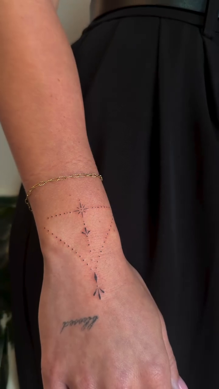 Delicate wrist and arm tattoos ornamental tattoo on the forearm by Fineline Tattoos DFW