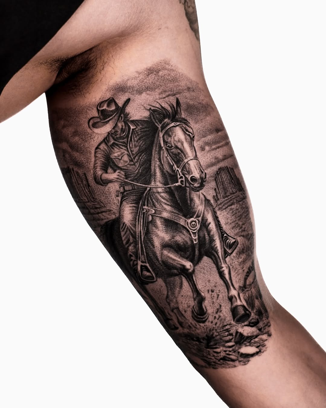 Cowboy riding a horse realism tattoo on the forearm by Enrique Martinez
