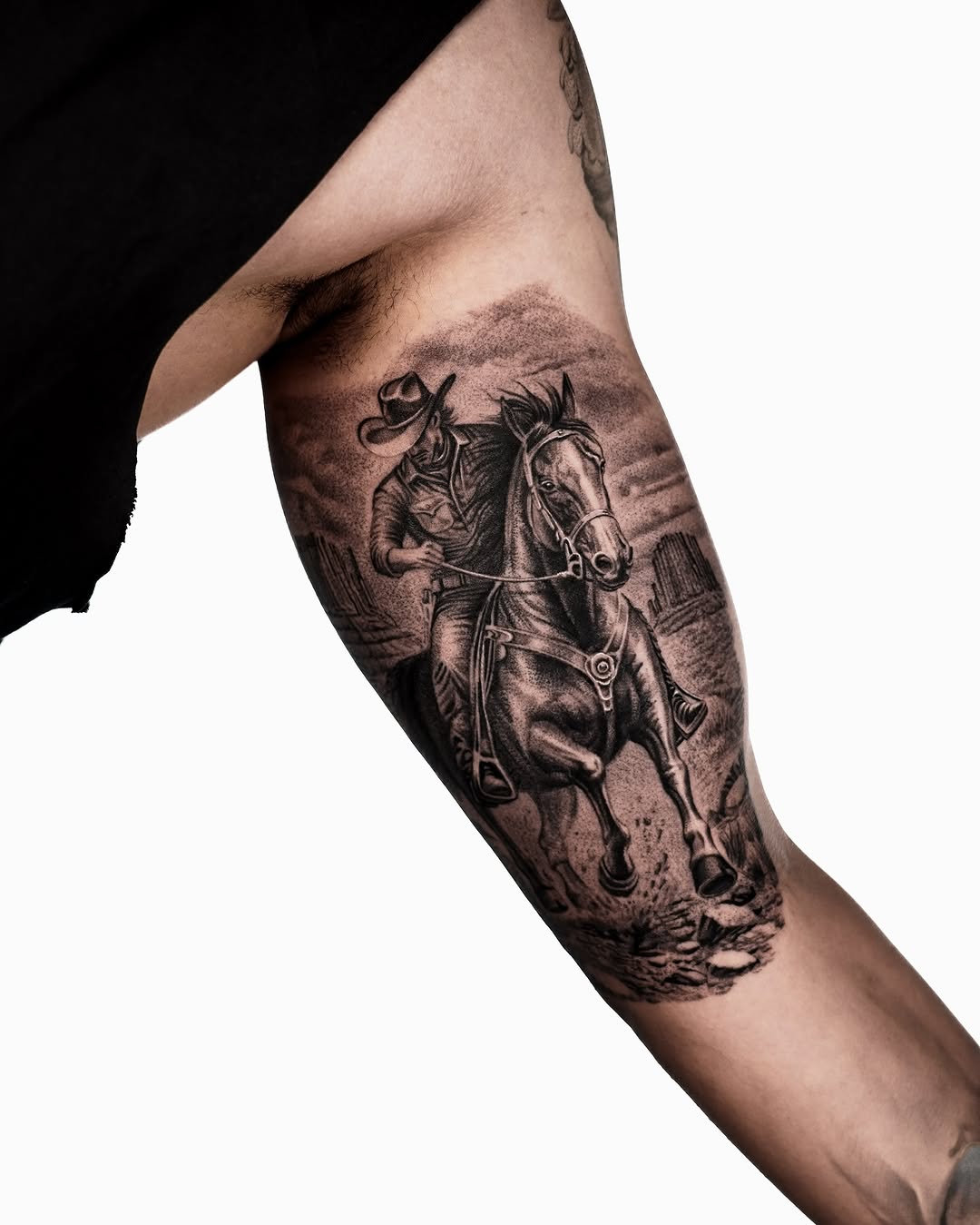 Cowboy riding a horse realism tattoo on the forearm by Enrique Martinez
