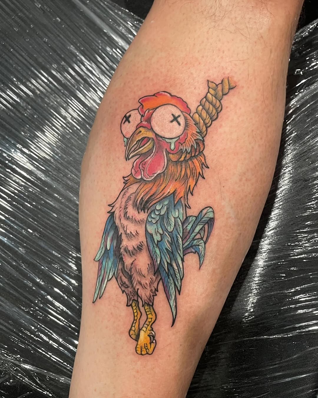 Hanging chicken American traditional tattoo on the forearm by Justin Evans kc ink
