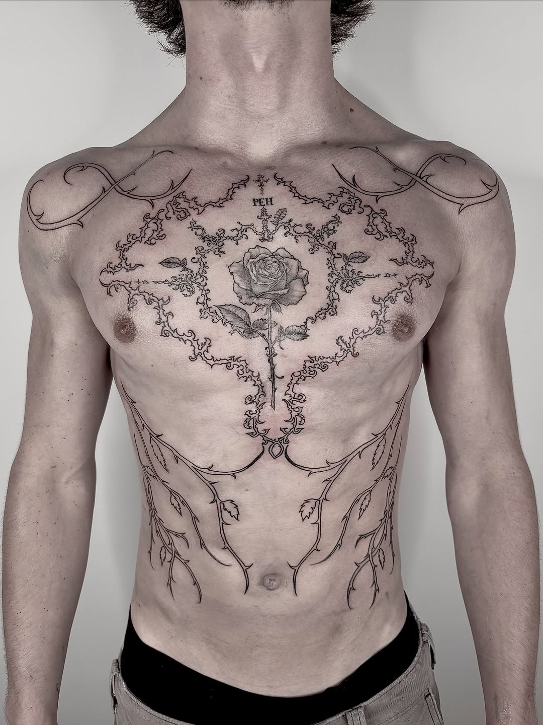 Rose and thorny vines blackwork tattoo on the chest by <3 eve’s tattoos <3