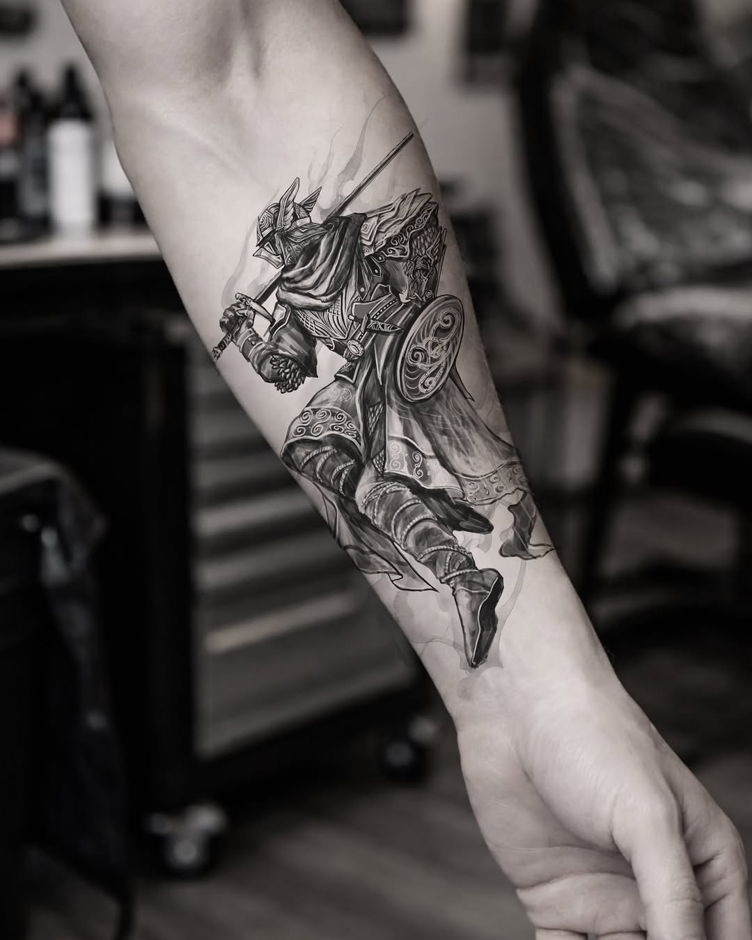 Armored warrior with sword and shield realism tattoo on the forearm by ๐๐ฆ๐ฐ๐ฆ๐
