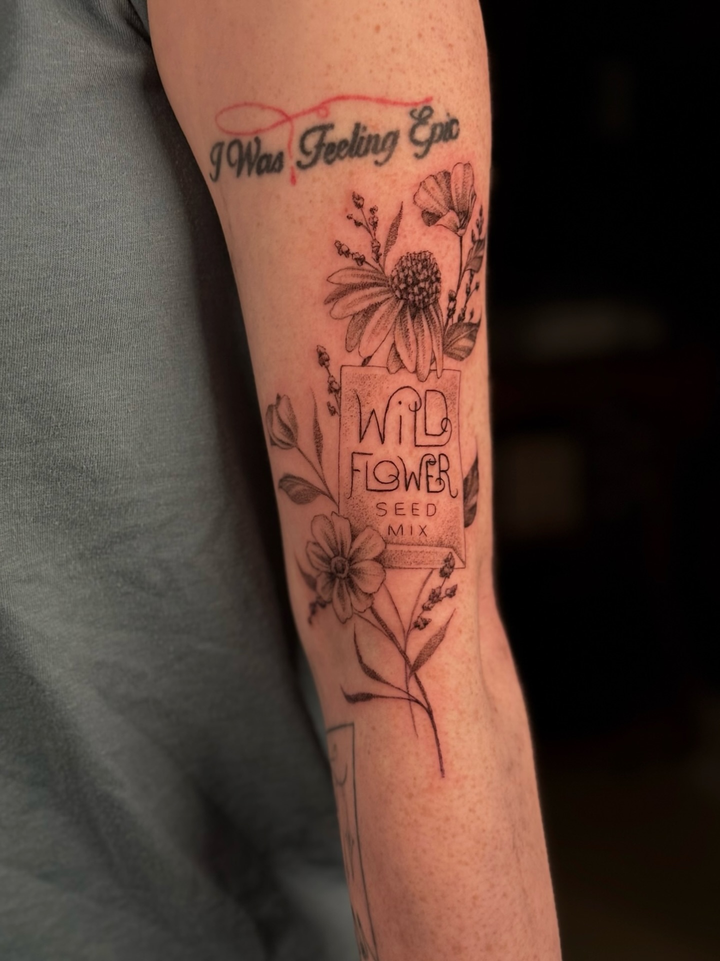Wildflower seed mix black and grey tattoo on the forearm by Alyssa Fazzino ⟡ CT Tattoo Artist, Rocky Hill, Connecticut