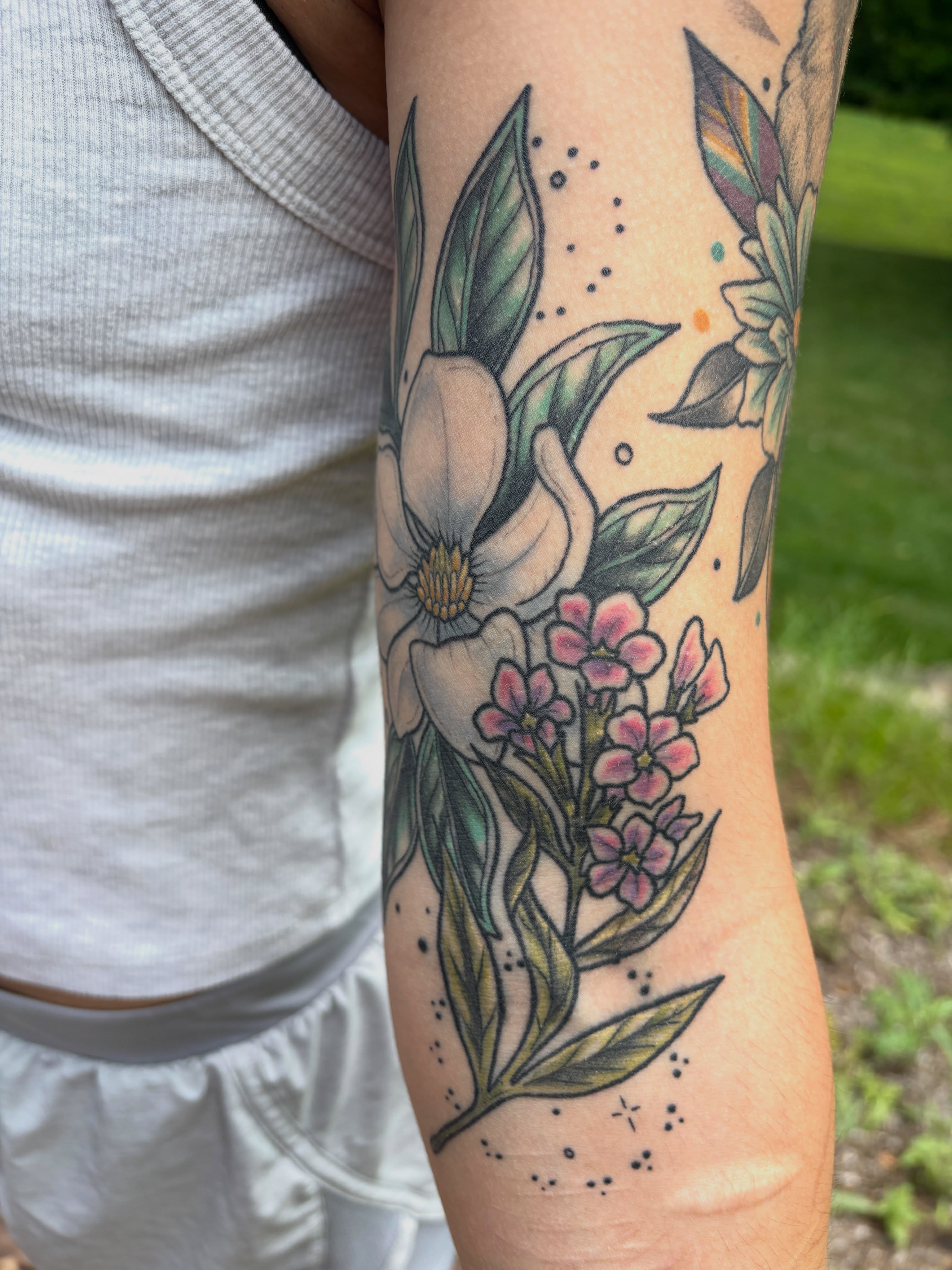 Floral arrangement dotwork tattoo on the forearm by AJ Jensen