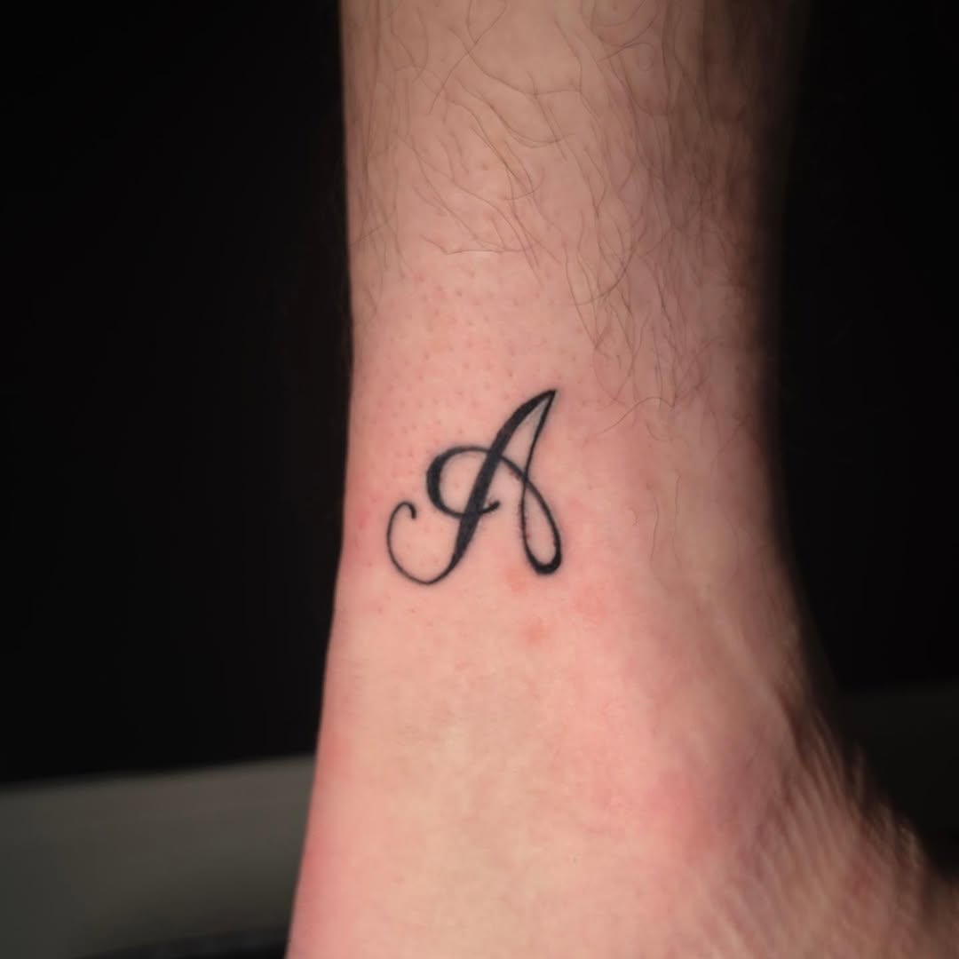Letter A lettering tattoo on the forearm by Scar