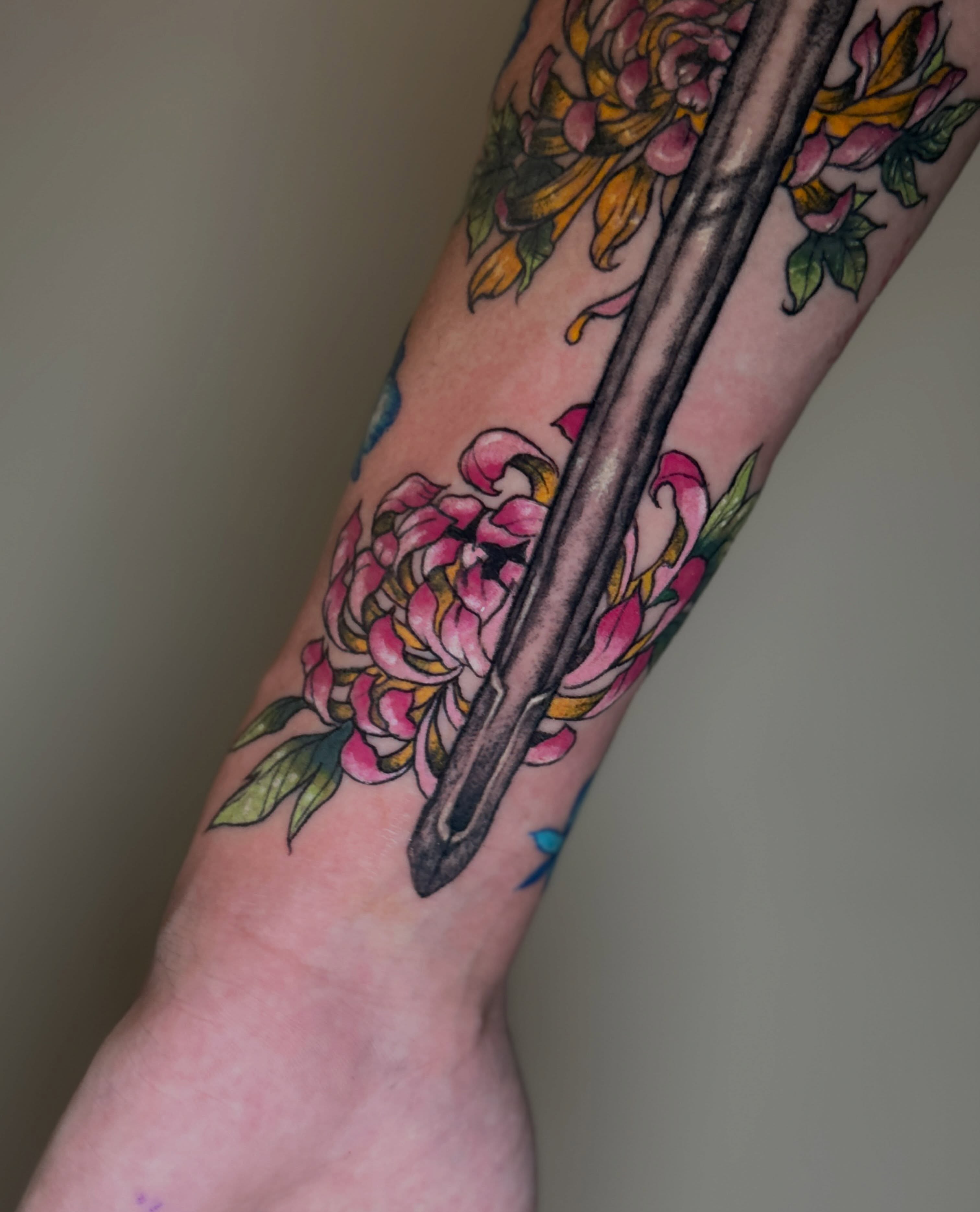 Chopsticks and flowers American traditional tattoo on the forearm by Alex