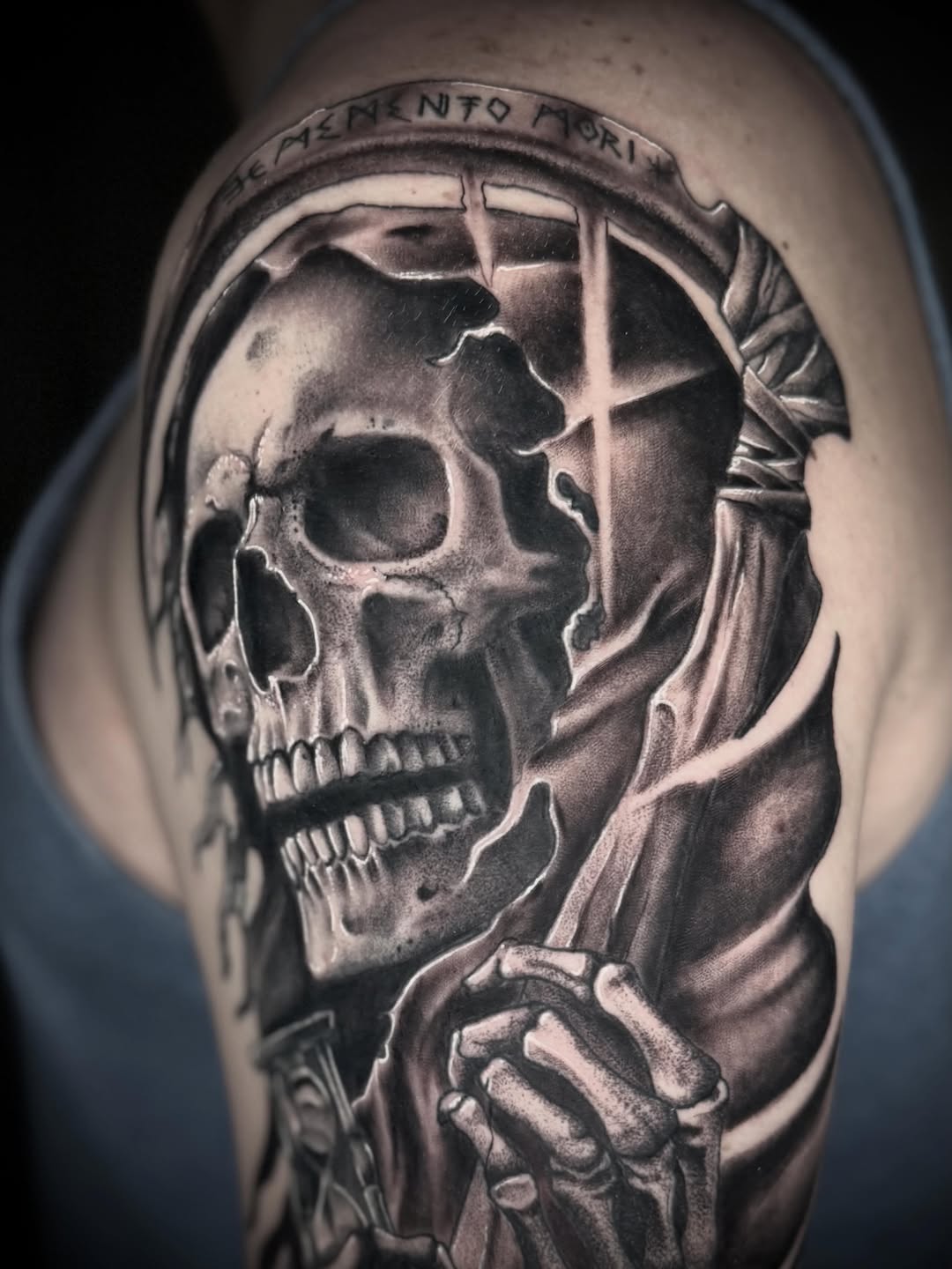 Grim reaper skull with hourglass realism tattoo on the shoulder by Terence Taylor