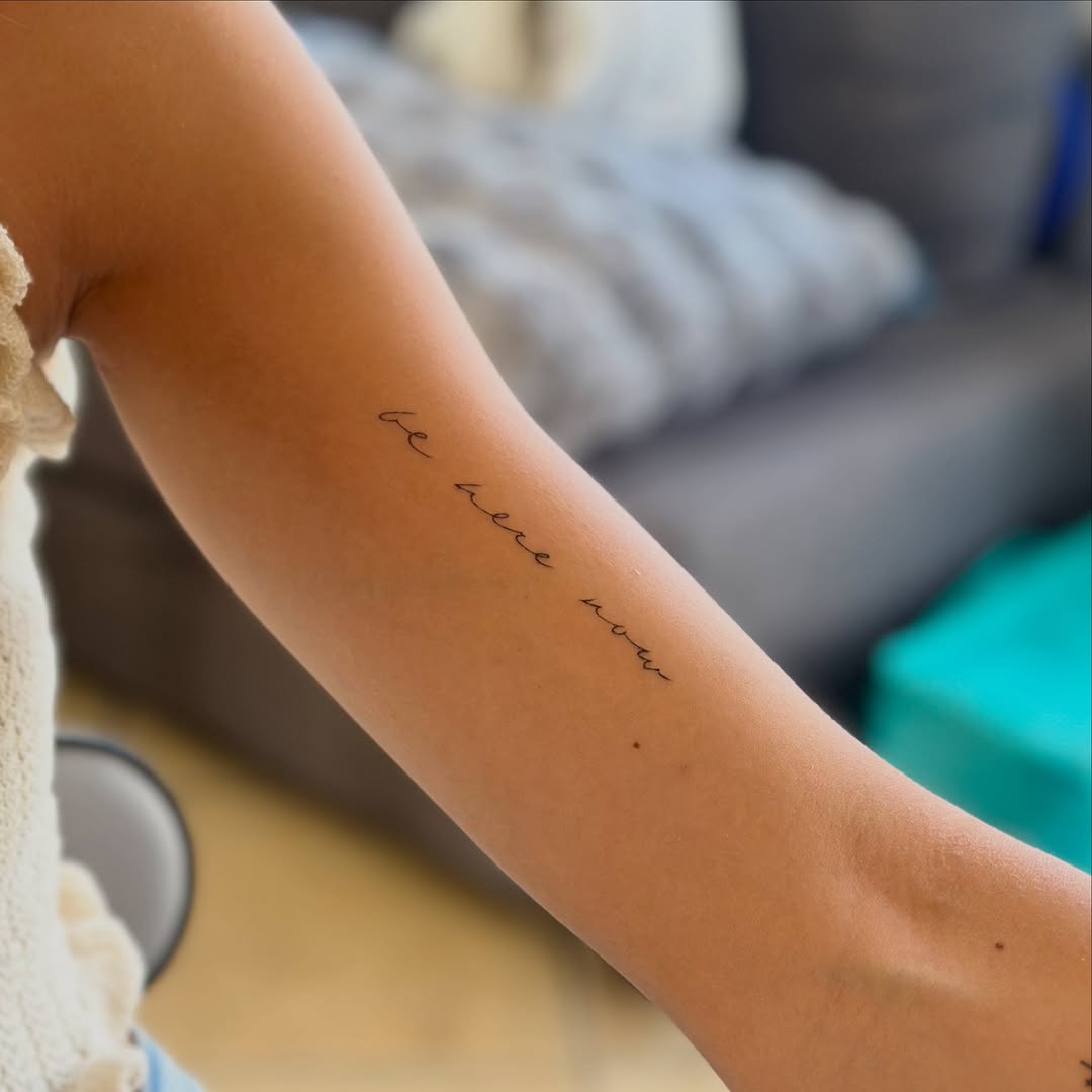 Script lettering lettering tattoo on the forearm by Tattoo Takayo