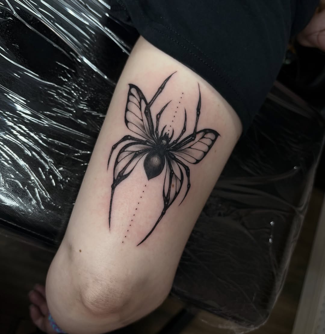 Spider with butterfly wings blackwork tattoo on the forearm by Cincinnati Tattoo Artist