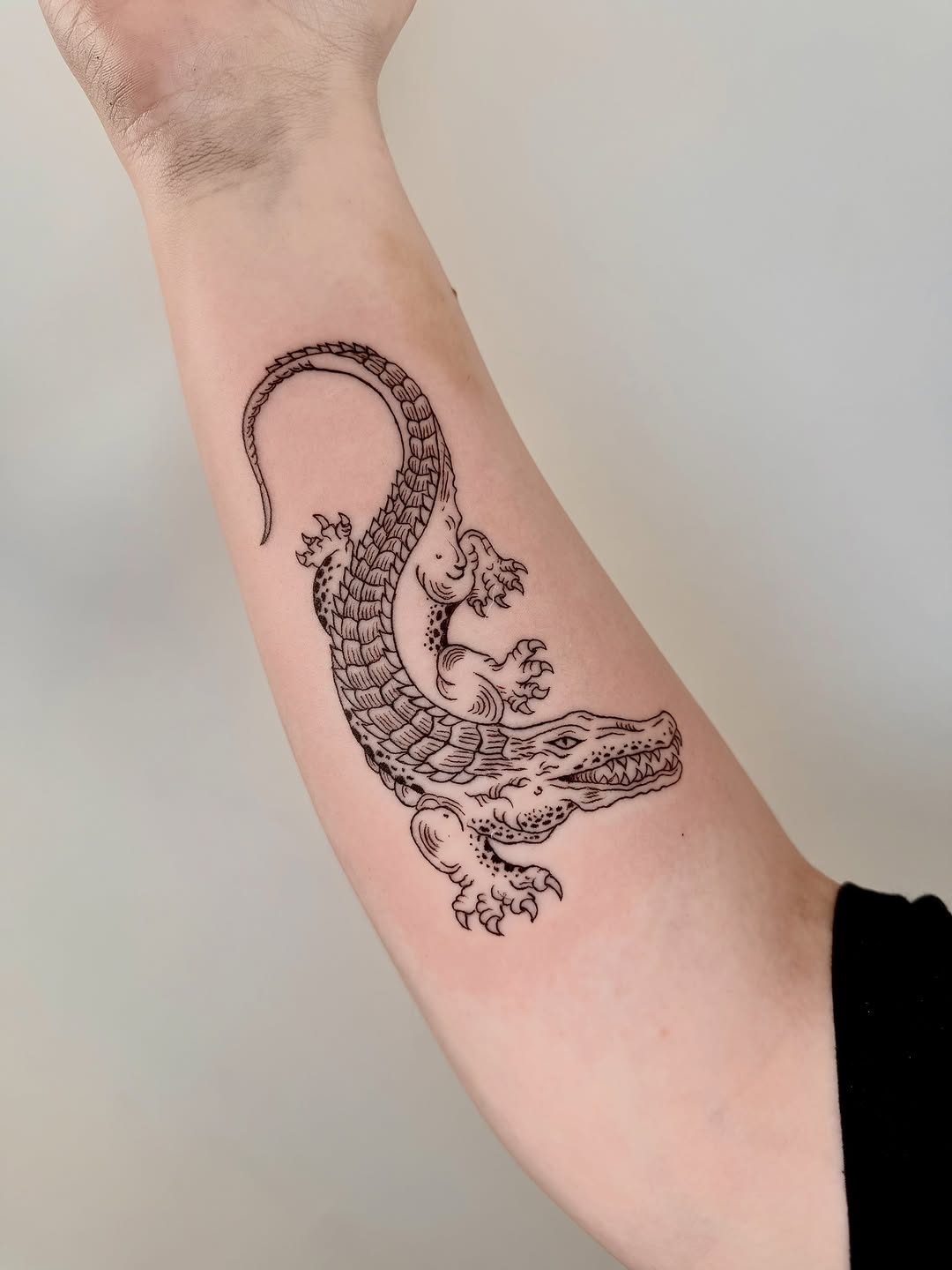 Alligator realism tattoo on the forearm by Fine Line Tattoo Artist