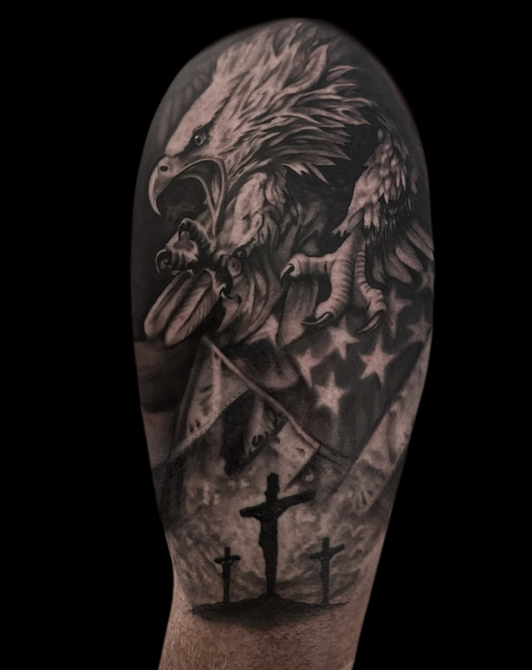 Eagle with American flag and crucifixions realism tattoo on the forearm by Jen Bean, Richmond, Virginia