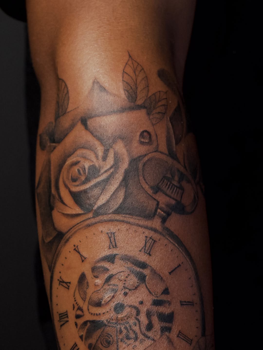 Pocket watch and rose realism tattoo on the forearm by Vu Nguyen