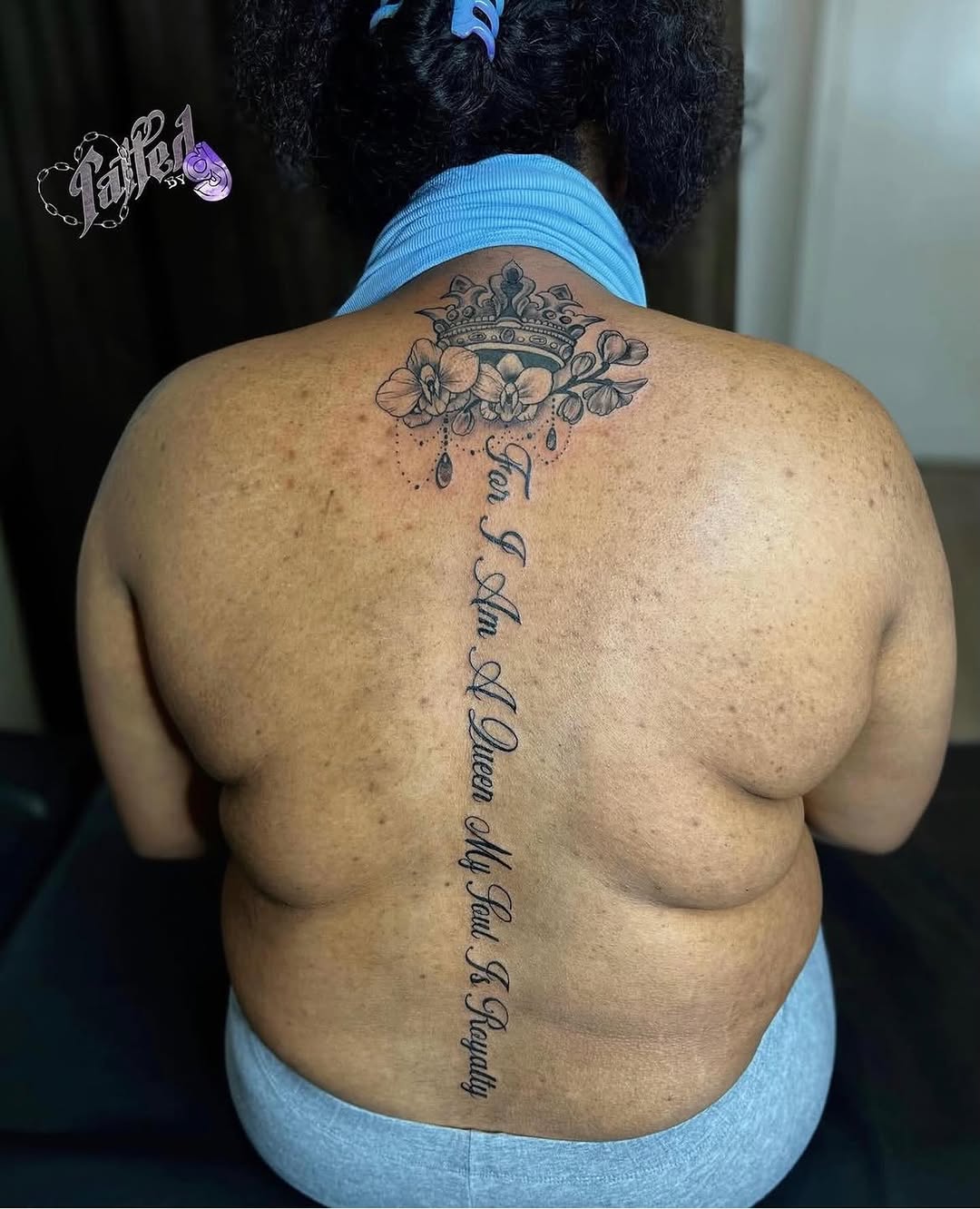 Crown with flowers and script lettering lettering tattoo on the back by Dallas Tattoo Artist