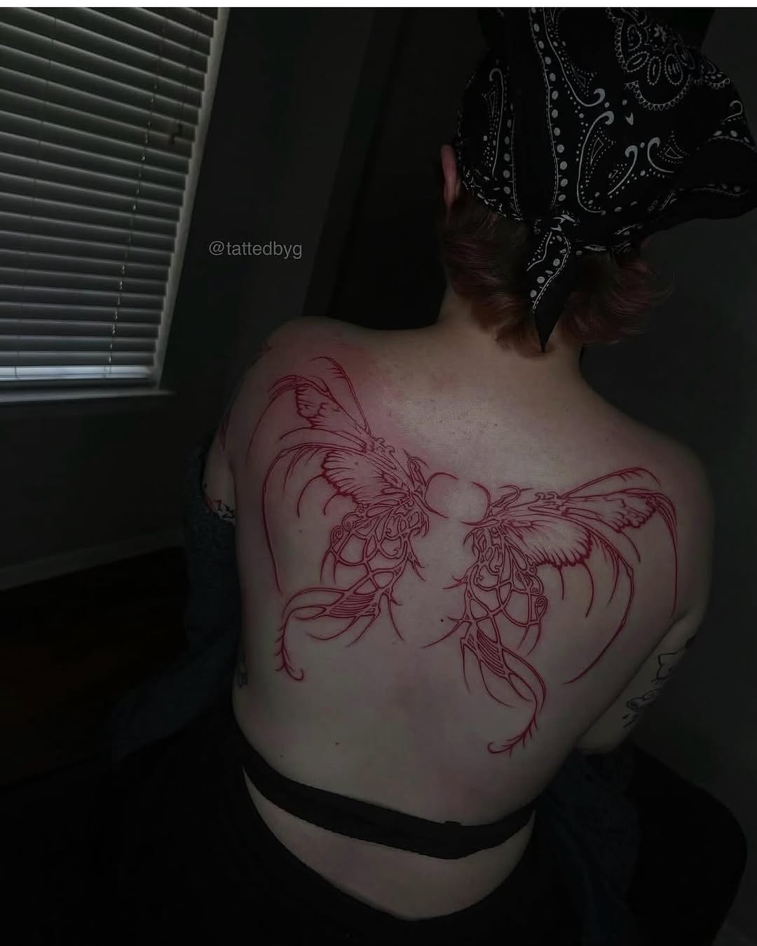 Two abstract winged creatures blackwork tattoo on the back by Dallas Tattoo Artist