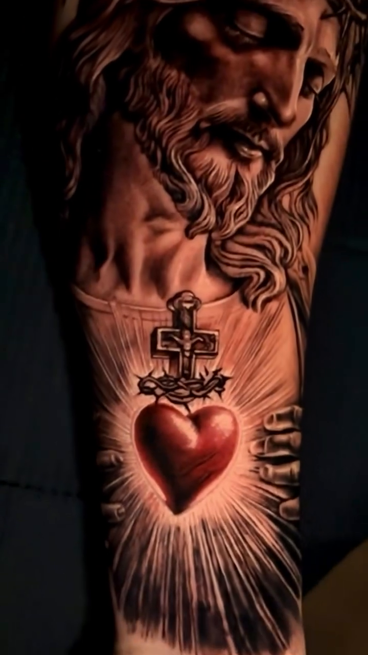 Jesus Christ portrait with Sacred Heart Chicano tattoo on the forearm by Omar Sheriff Herrera