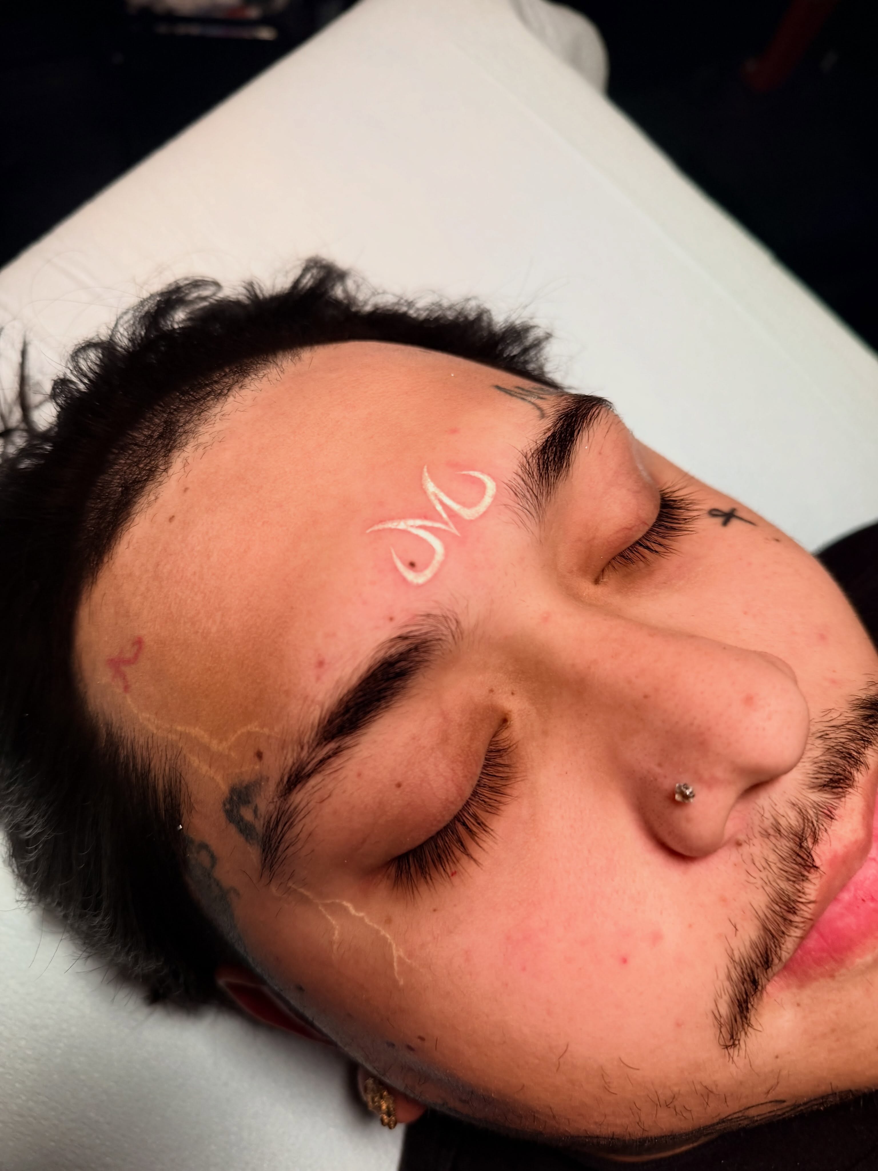 Script lettering lettering script tattoo on the head by Lettering