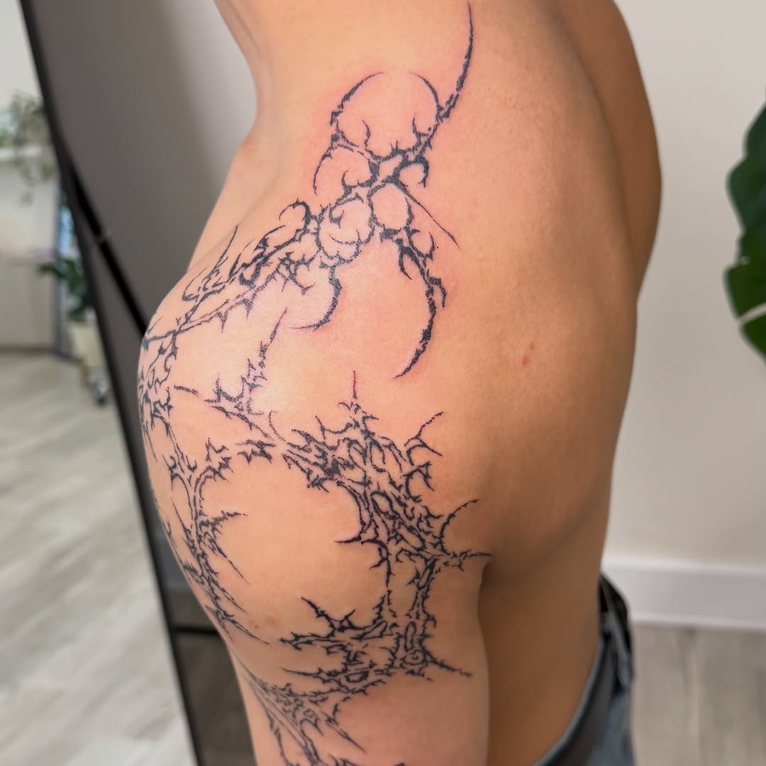 Abstract tribal pattern cyber sigilism tattoo on the thigh by David
