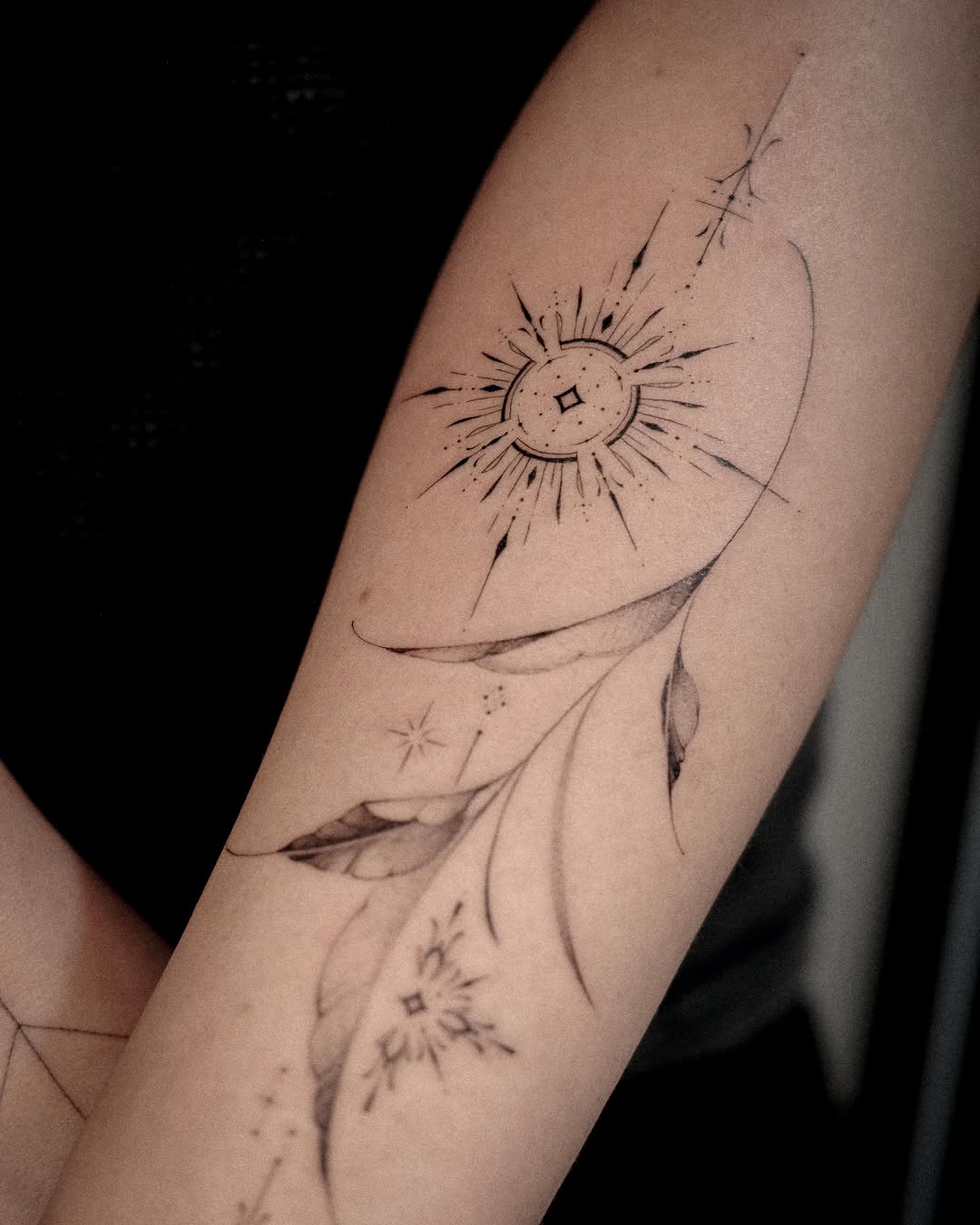 Compass and leaves ornamental tattoo on the forearm by Easy