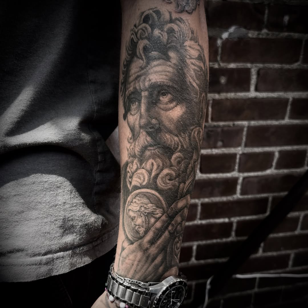 Surrealism tattoo on the forearm by Blake Van Vleck