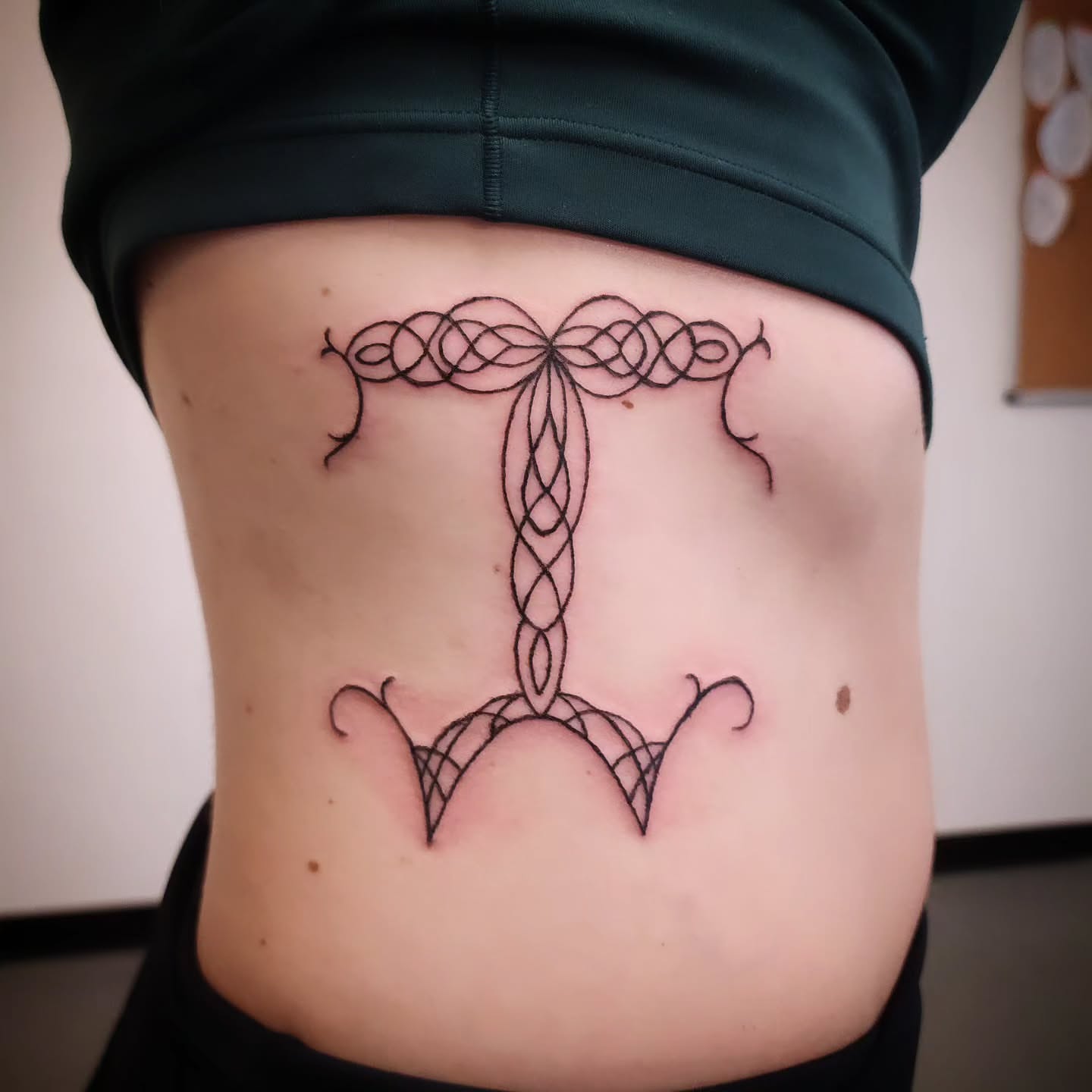 Knotwork black and grey tattoo on the torso by Anntonietta Borzacchiello