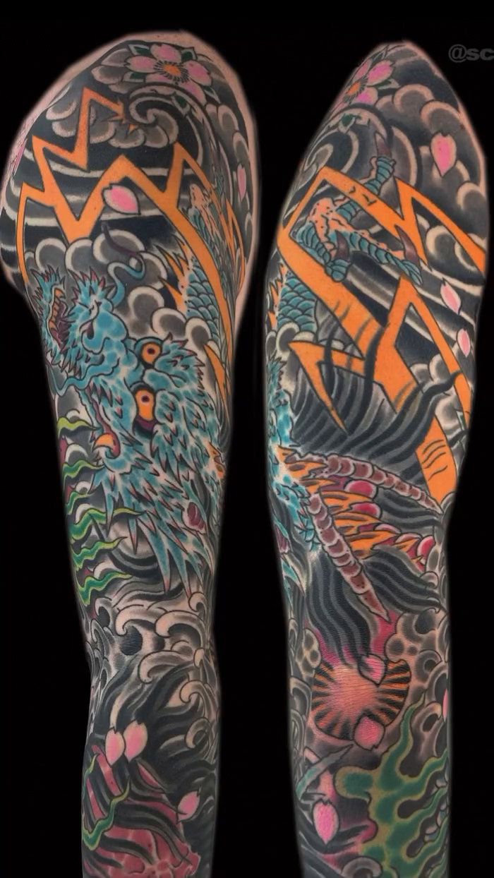 Dragon and waves sleeve Japanese tattoo on the forearm by Scott Allen Cooksey, Plano, Texas