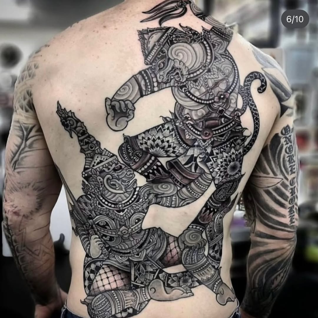 Hanuman fighting a demon geometric tattoo on the back by miami tattoo artist