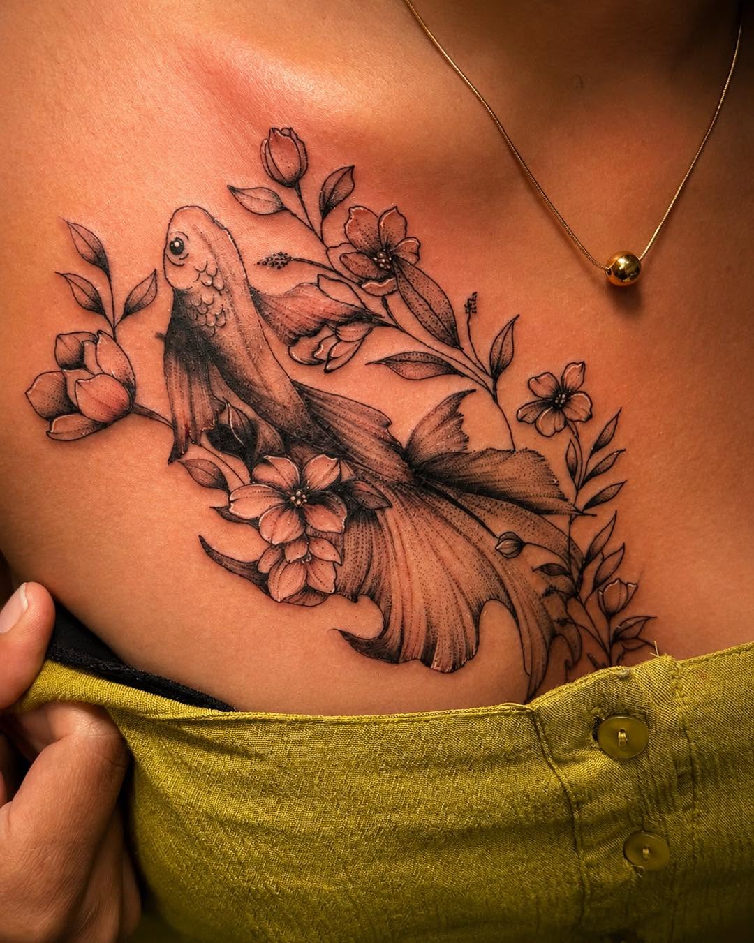 Goldfish and flowers fine line tattoo on the ribs by Flamboyant