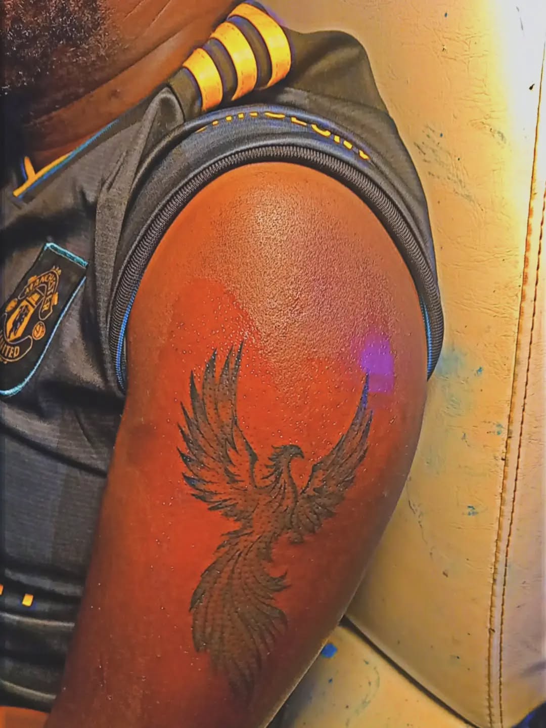 Phoenix realism tattoo on the upper arm by Mwangaza Bodyworks, Uthiru, Nairobi Area, Kenya