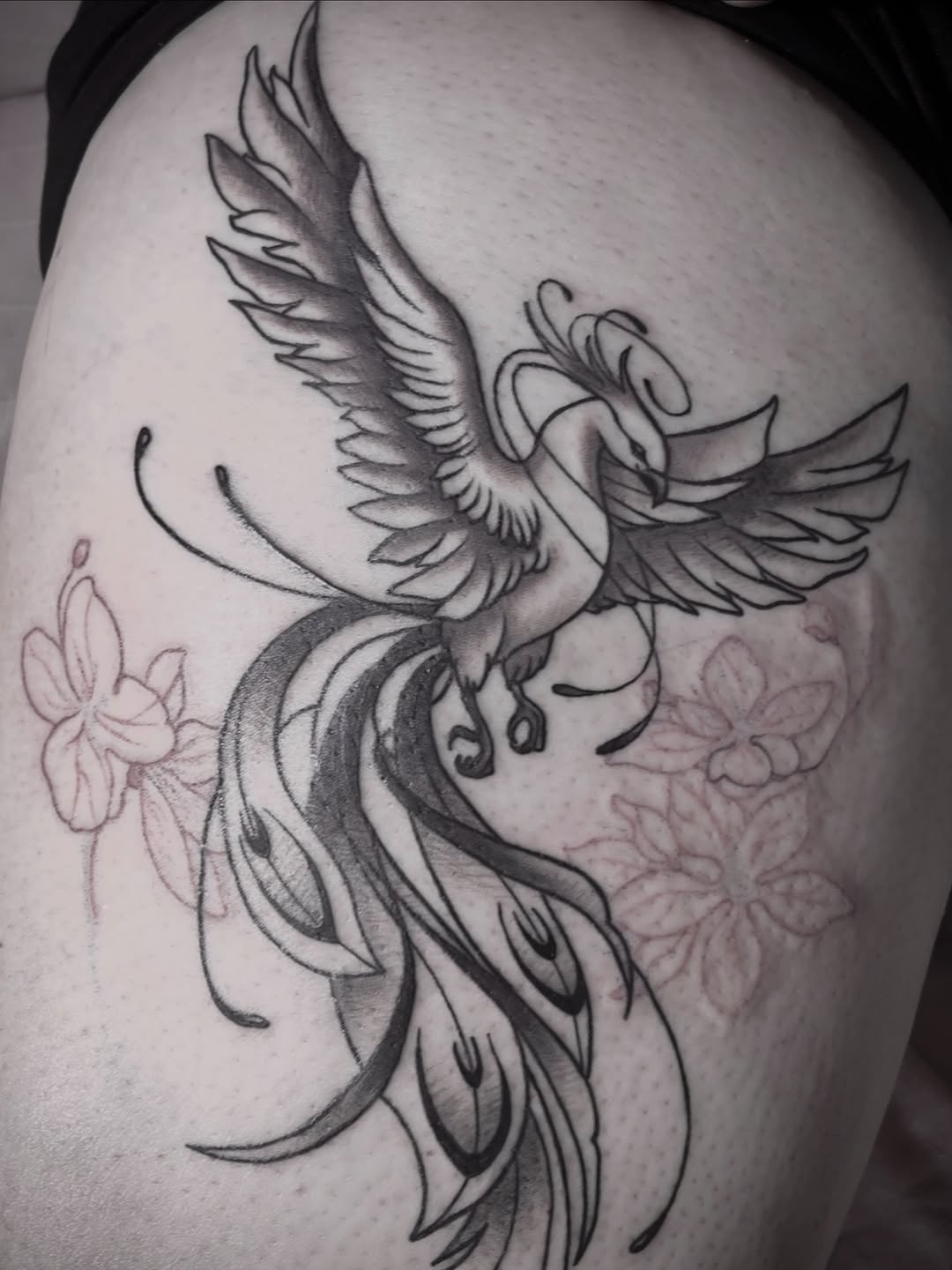 Phoenix and flowers watercolor tattoo on the thigh by Stefany🩸