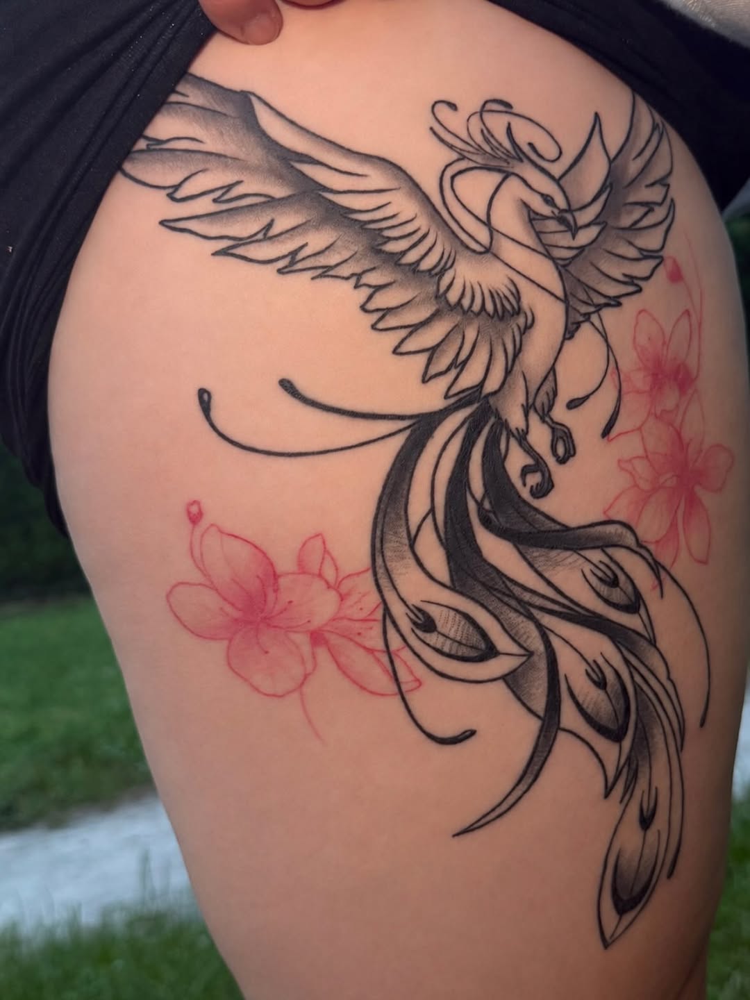 Phoenix and flowers watercolor tattoo on the thigh by Stefany🩸