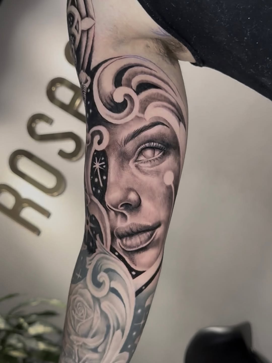 Woman's face with celestial elements Chicano tattoo on the forearm by Clayderman