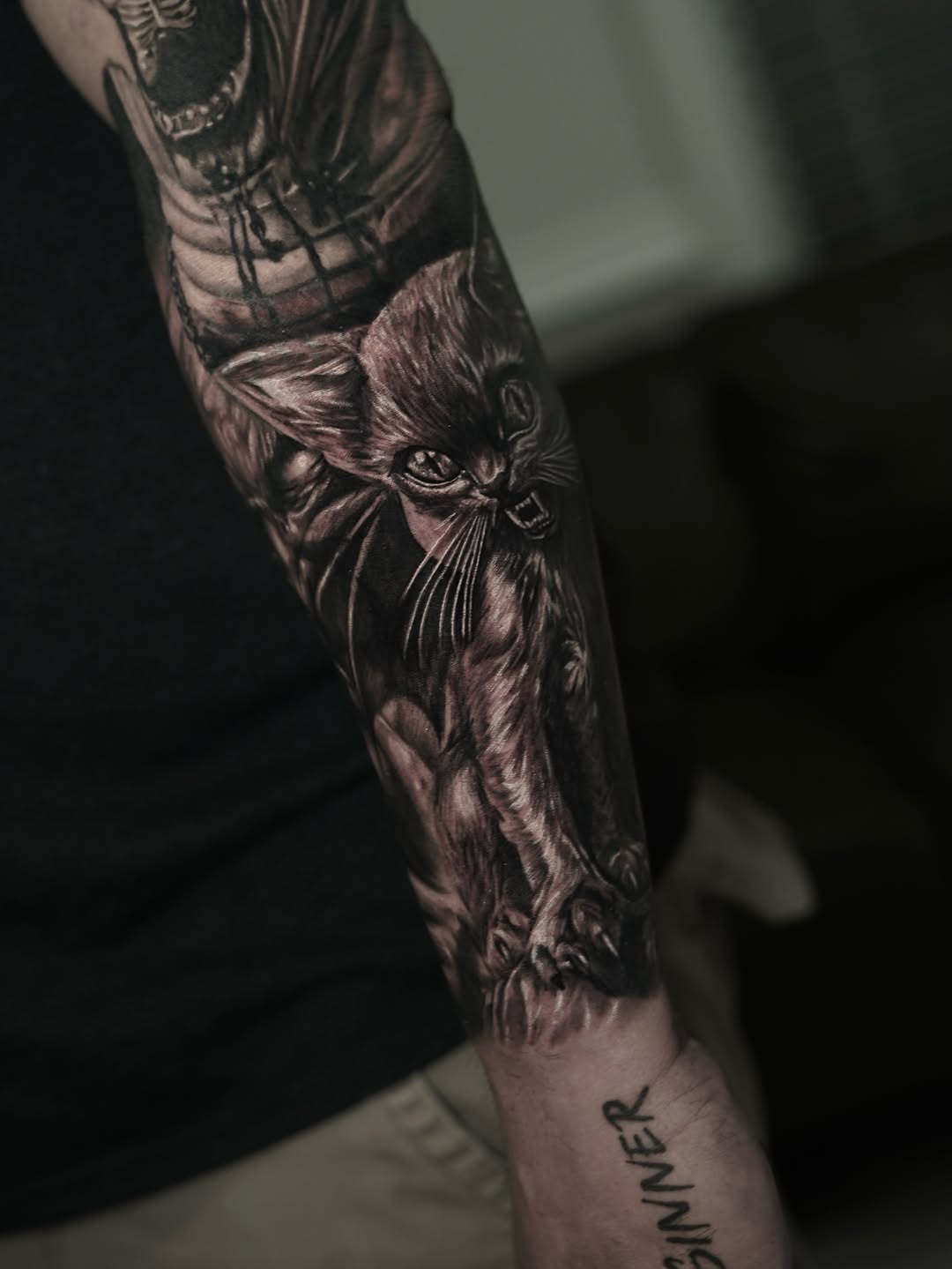 Ferocious cat realism tattoo on the forearm by Nelson Tellez