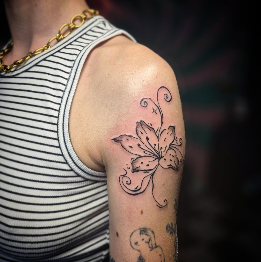 Lily flower fine line tattoo on the shoulder by π΅ππππ§π»ββοΈβΛκ©ο½‘β