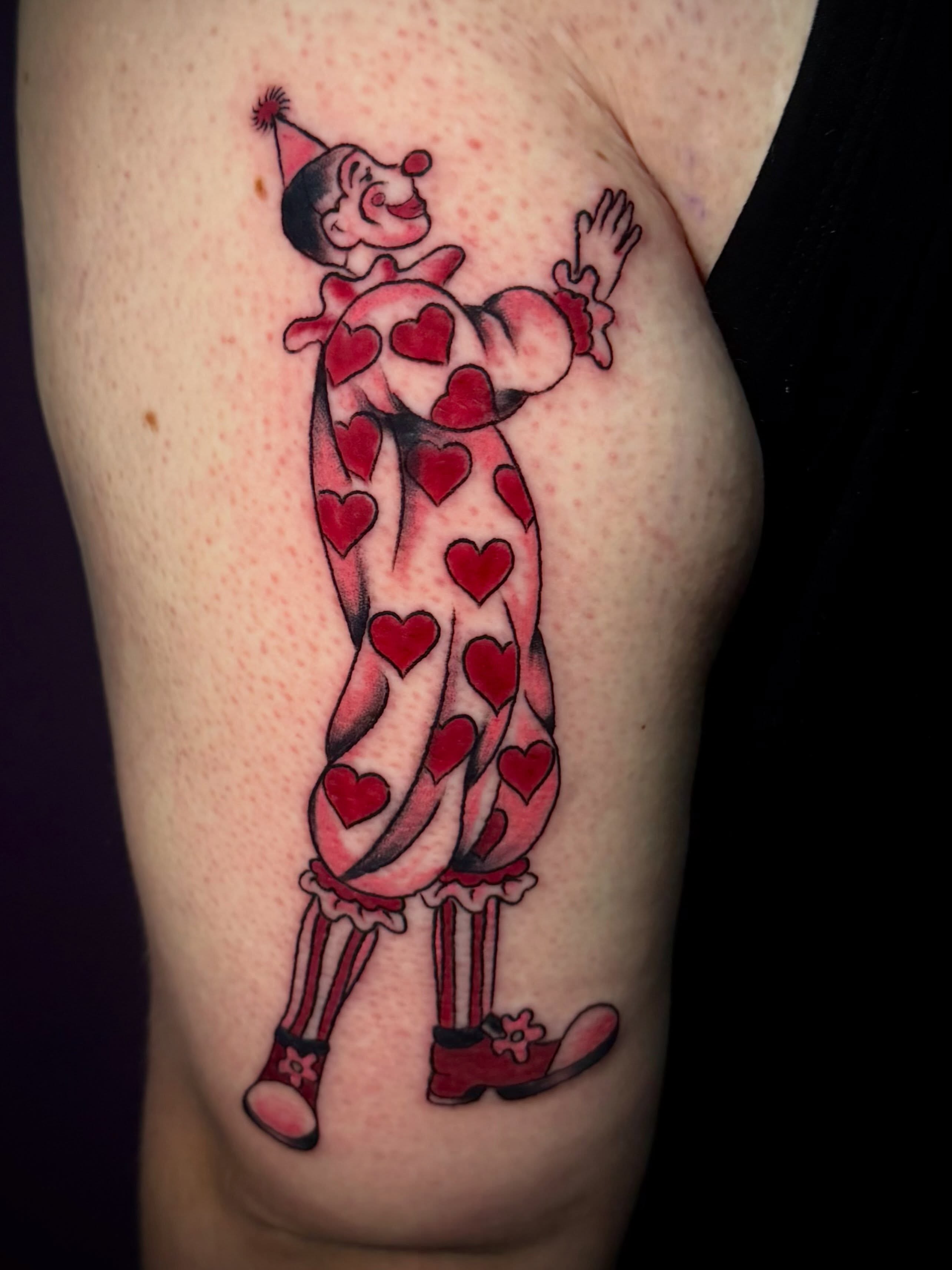 Clown American traditional tattoo on the thigh by Lydia