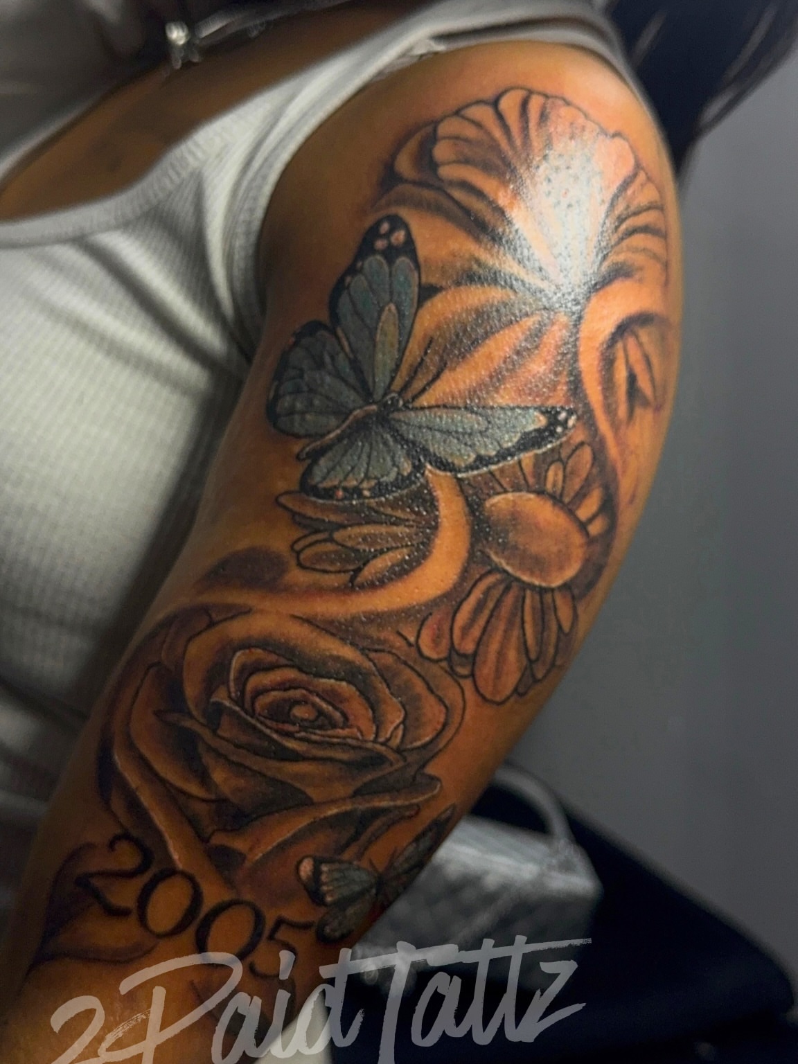 Butterfly and flowers realism tattoo on the forearm by 2PaidTattz