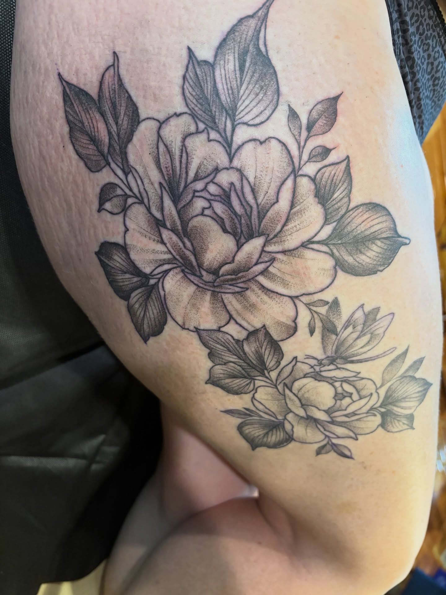 Peony black and grey tattoo on the thigh by Komfort Kristy