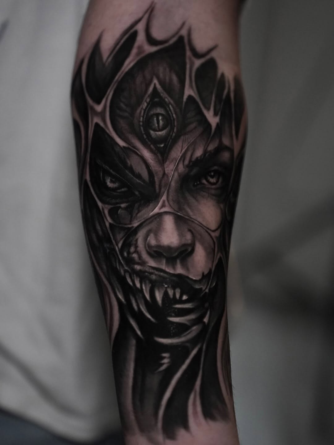 Demonic face with third eye realism tattoo on the forearm by Juan Russo
