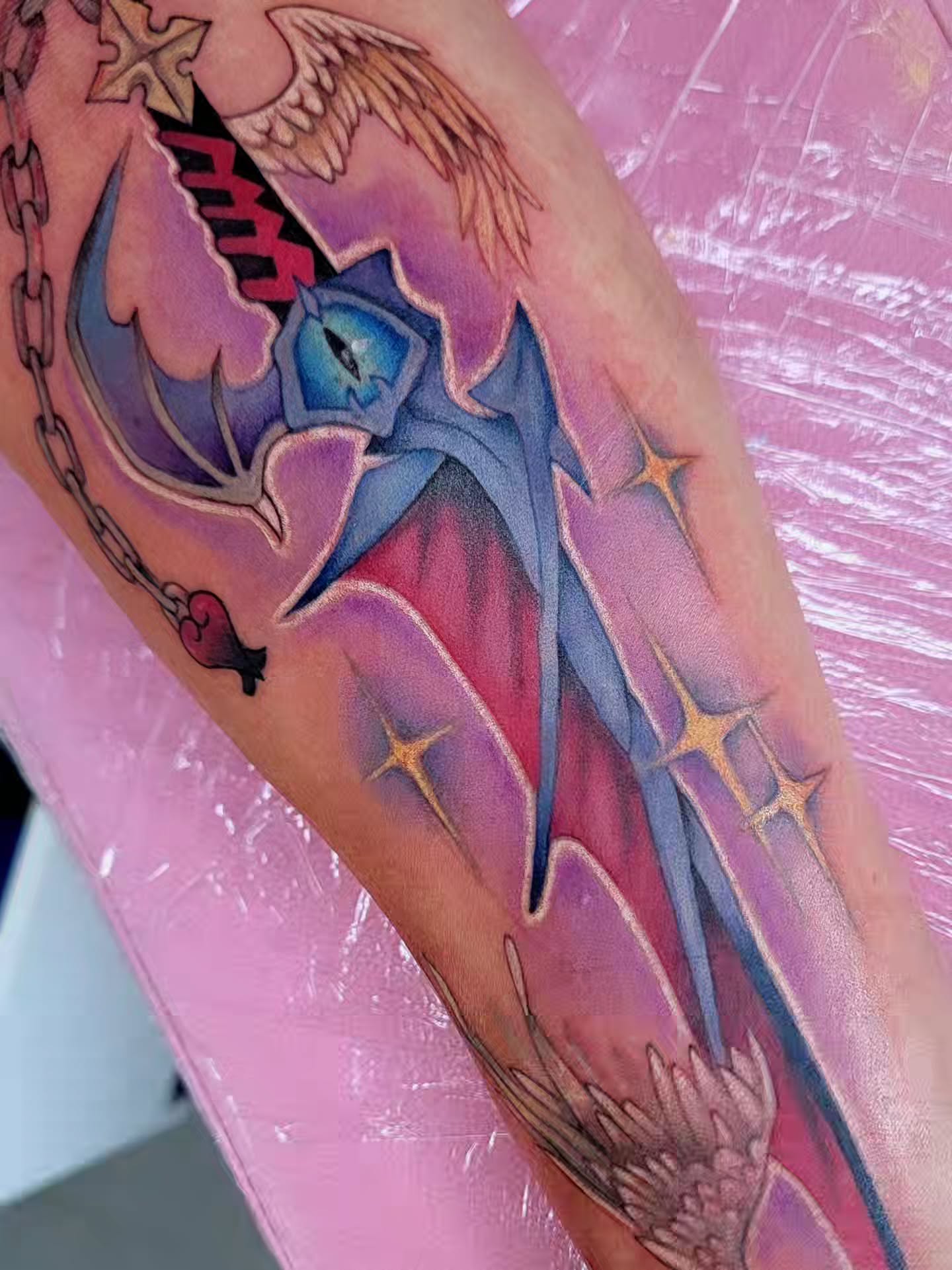 Bird and stars dotwork tattoo on the forearm by Kerry Rose