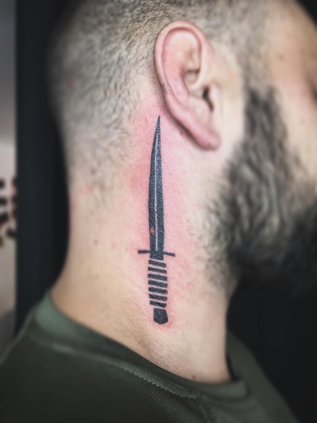 Dagger American traditional tattoo on the neck by Moss Quito Tattoo
