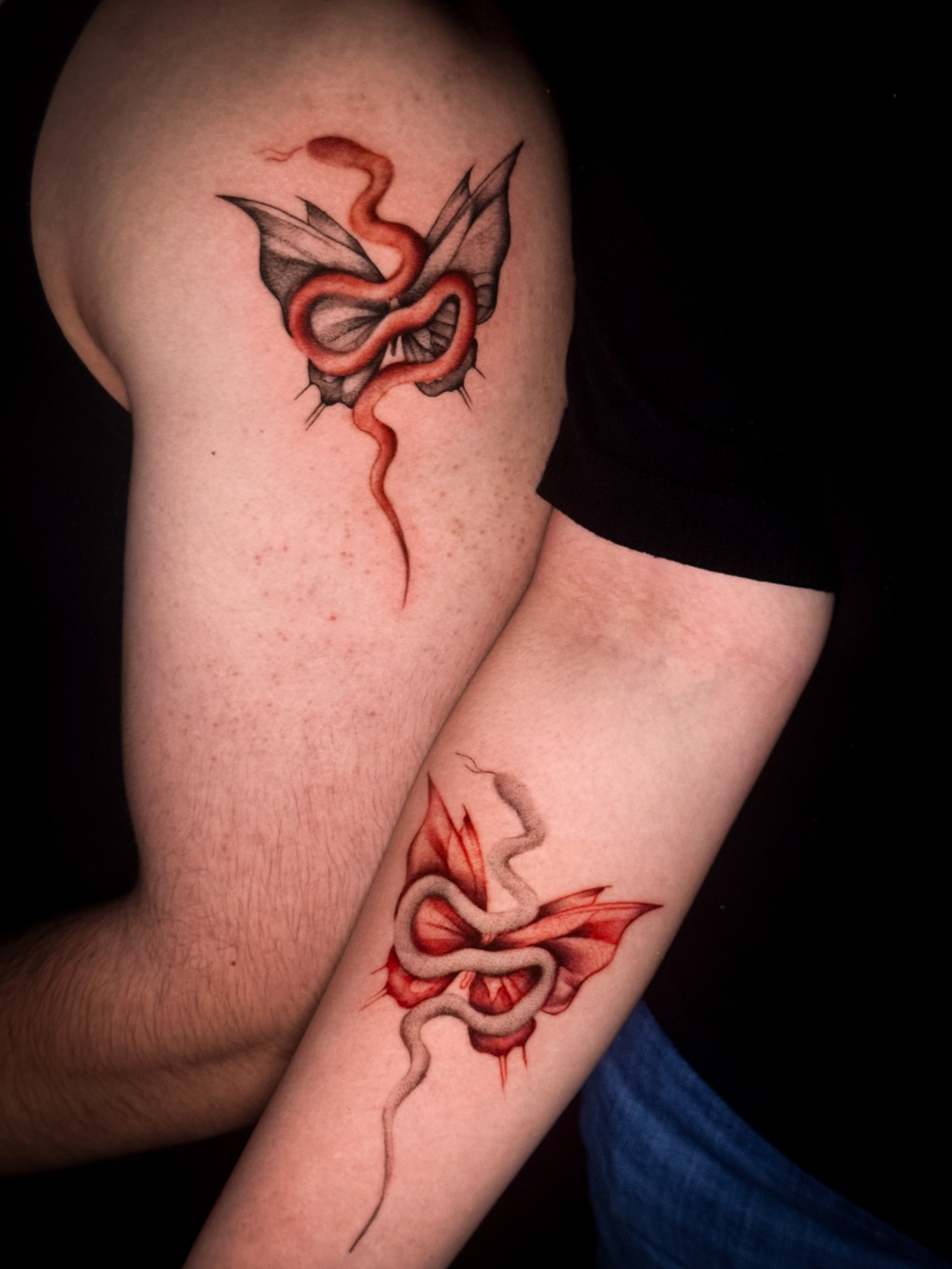 Snake and butterfly realism tattoo on the forearm by Jennifer Ramirez