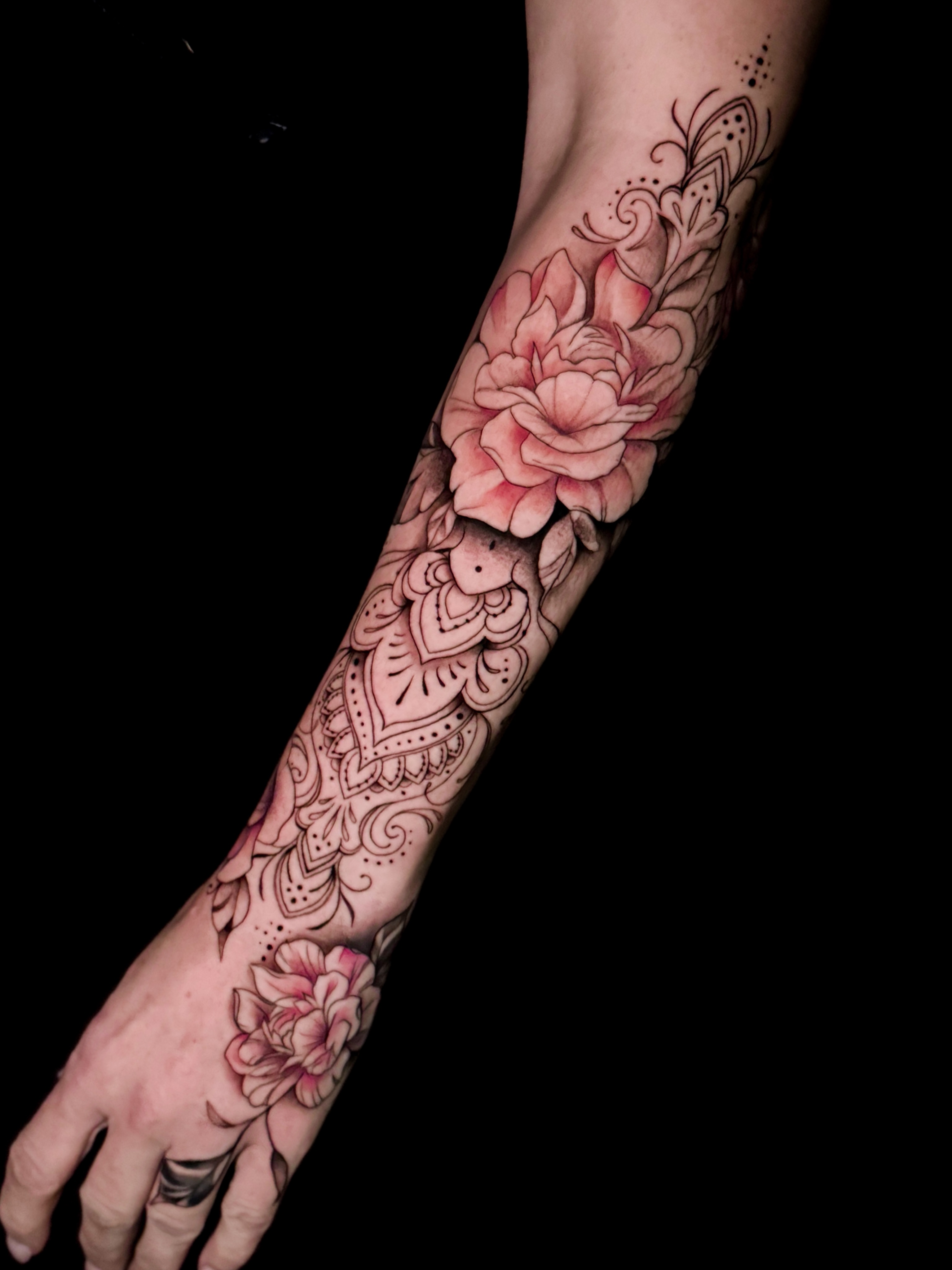 Floral design dotwork tattoo on the forearm by Jennifer Ramirez