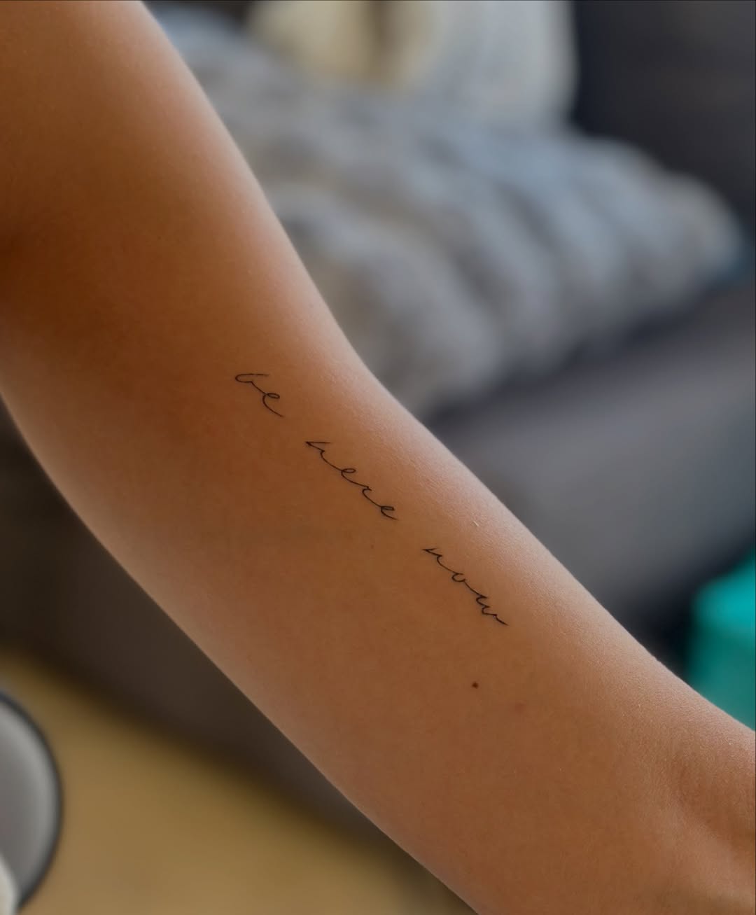 Script lettering lettering tattoo on the forearm by Tattoo Takayo